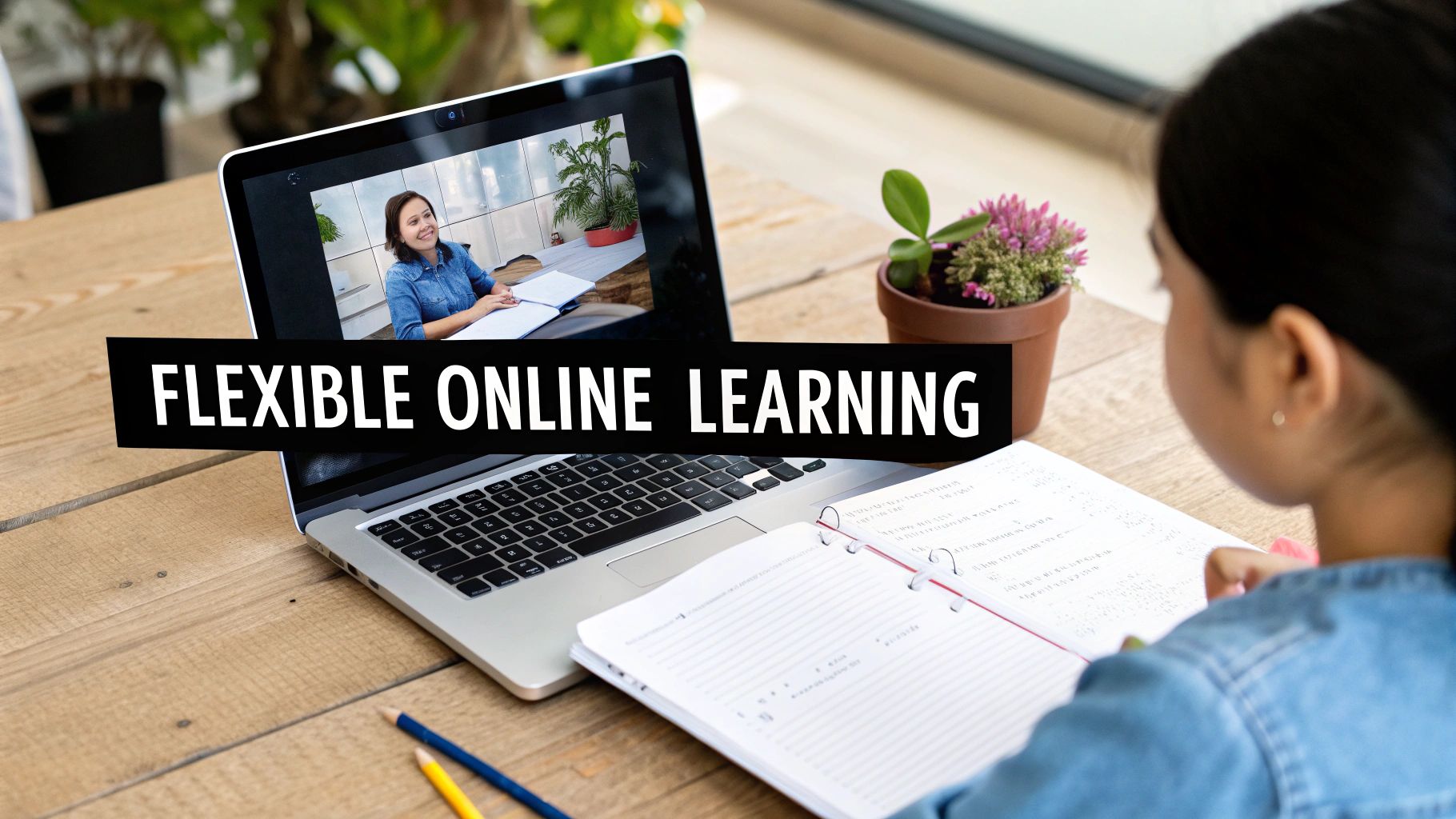 Student taking notes during a flexible online learning session on a laptop with a video call.