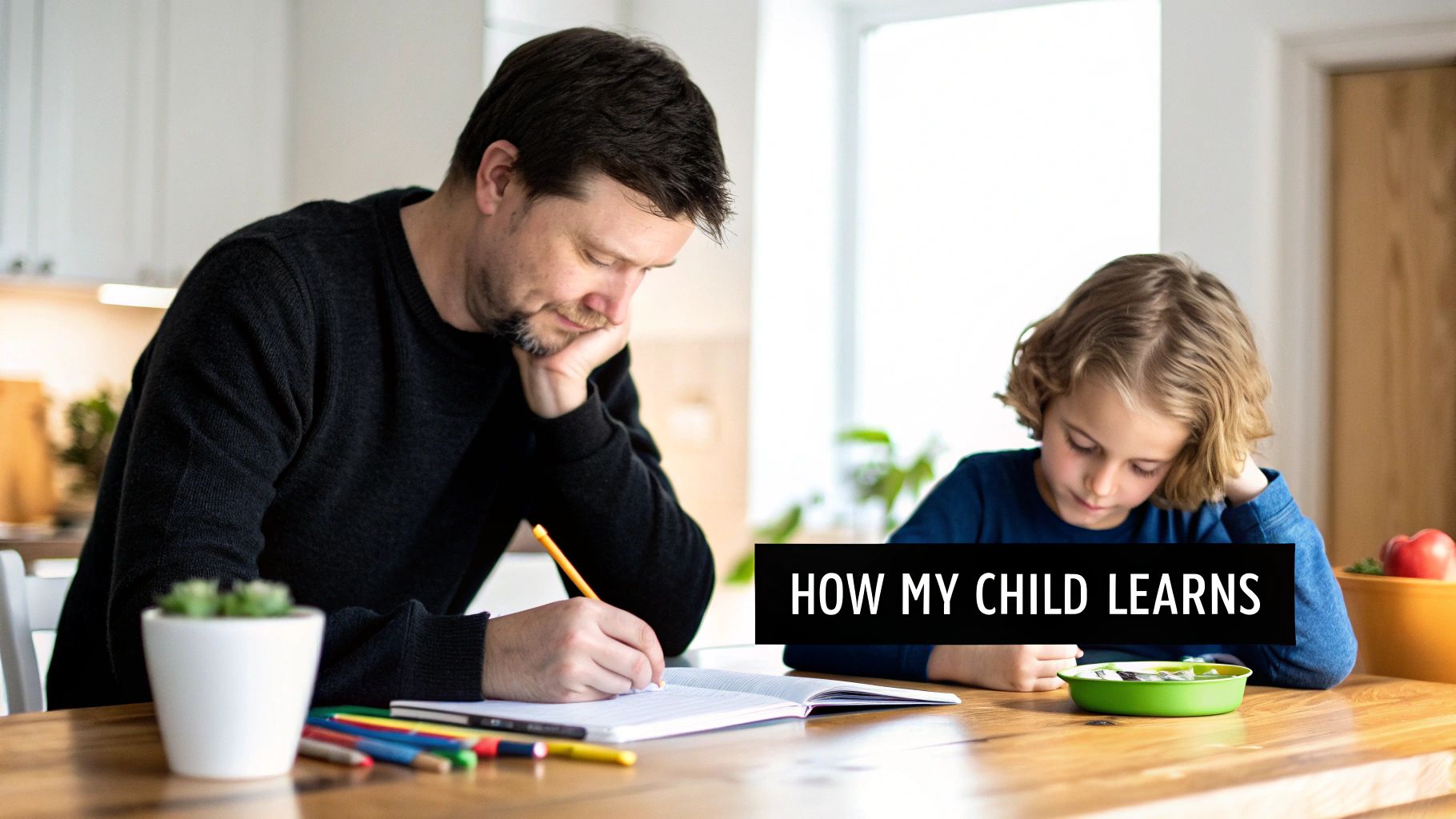 A father and child sit at a wooden table, both focused on a notebook during a learning session.