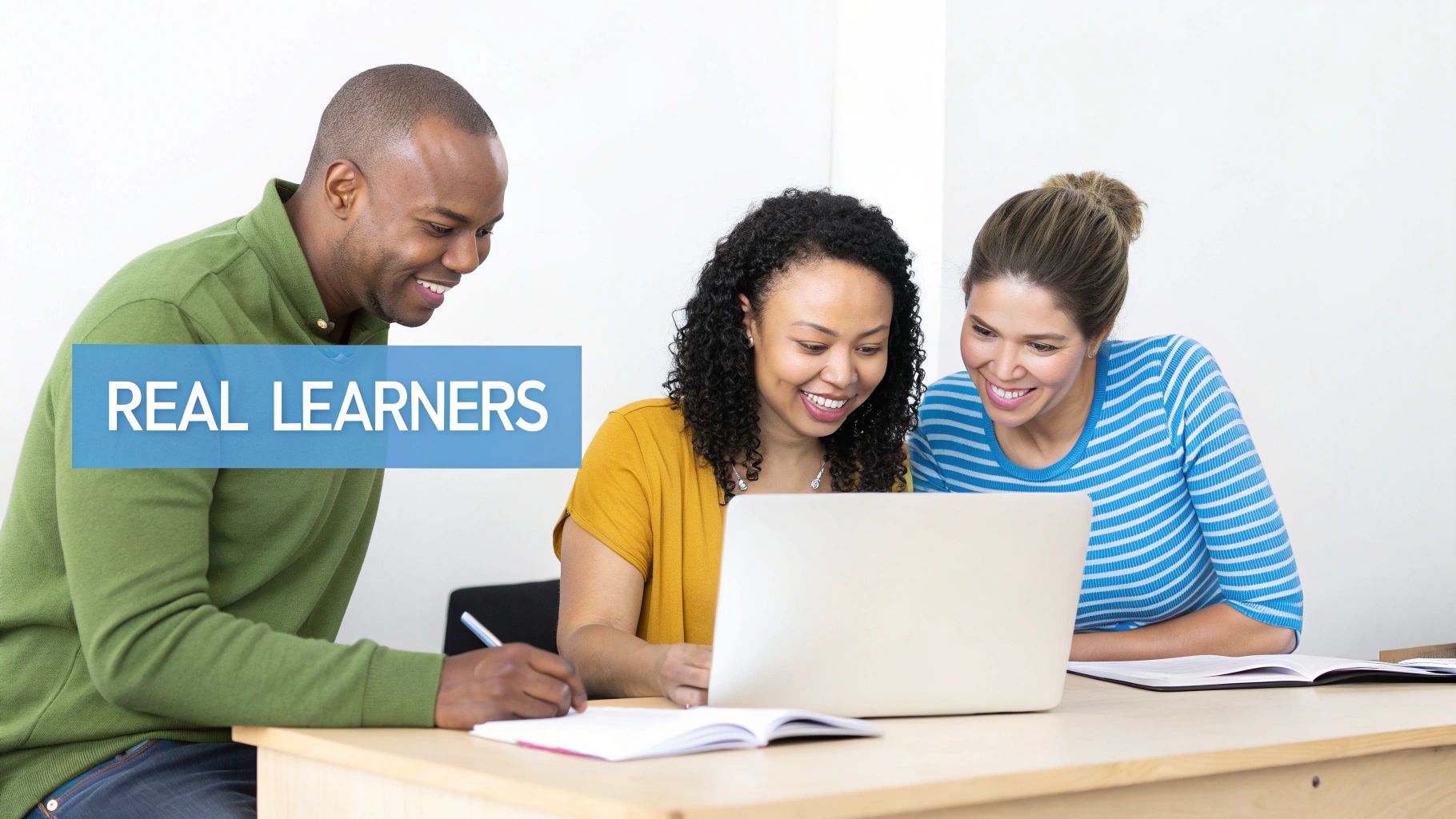 Happy diverse adults collaborating on a laptop and taking notes, with "REAL LEARNERS" text.