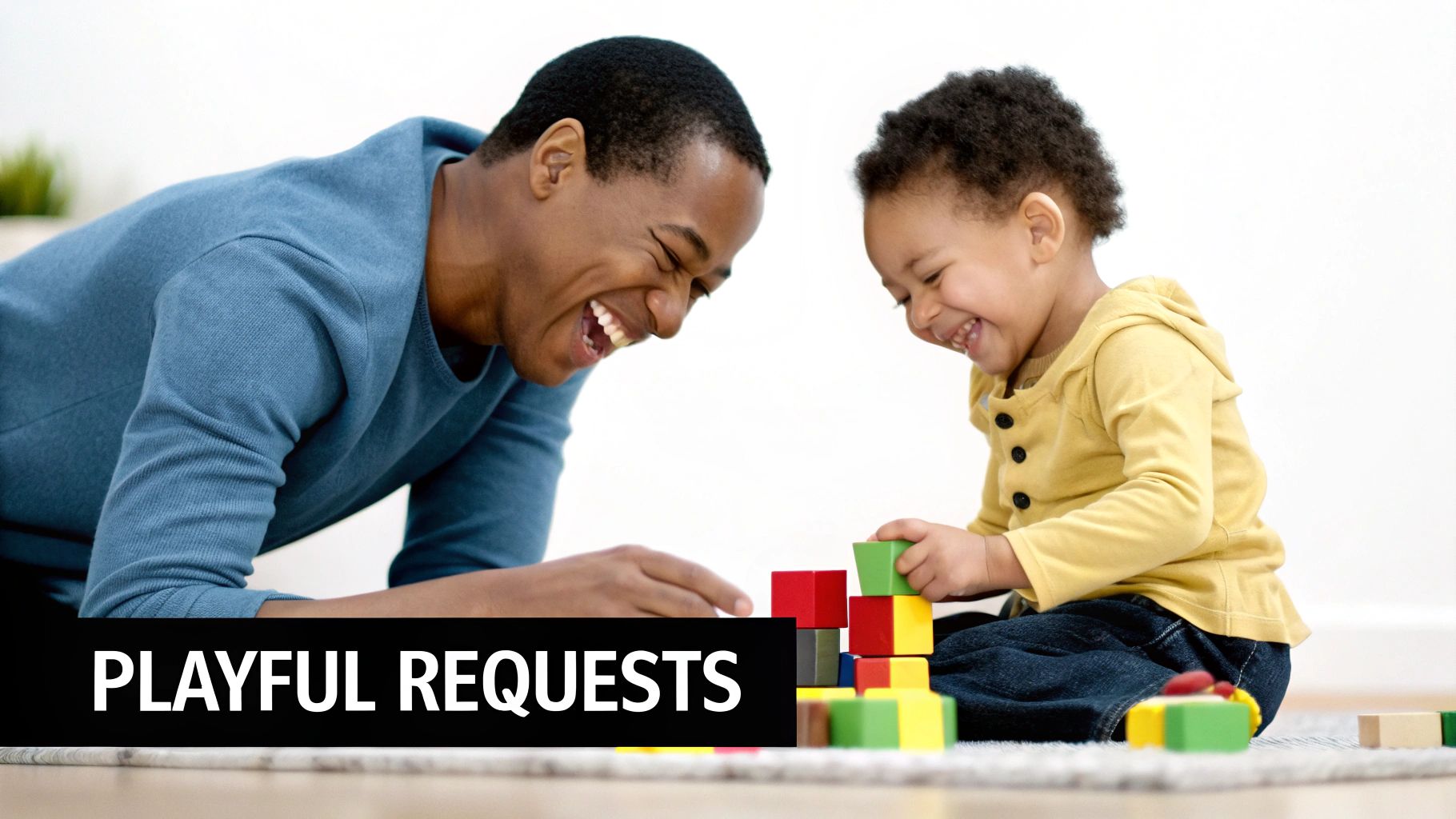 A joyful father and child laugh while playing with colorful building blocks on the floor.