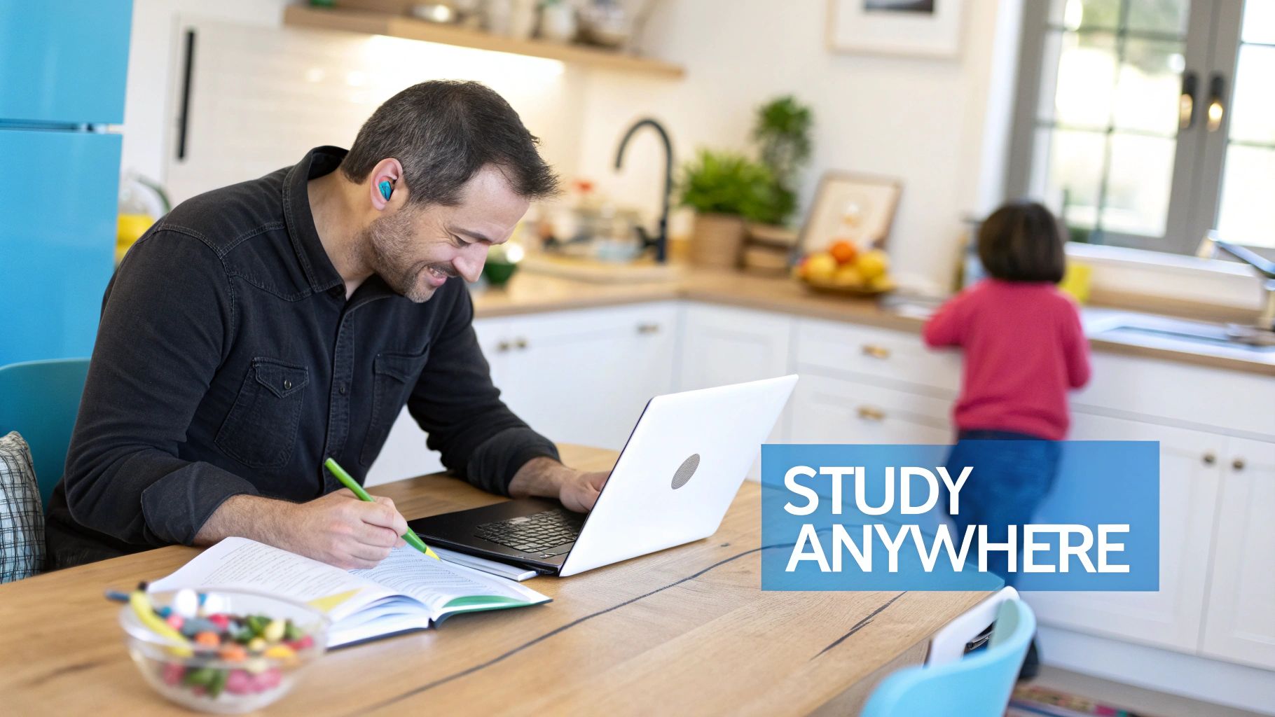 An individual sitting at a desk with a laptop, looking engaged and focused on their online studies.