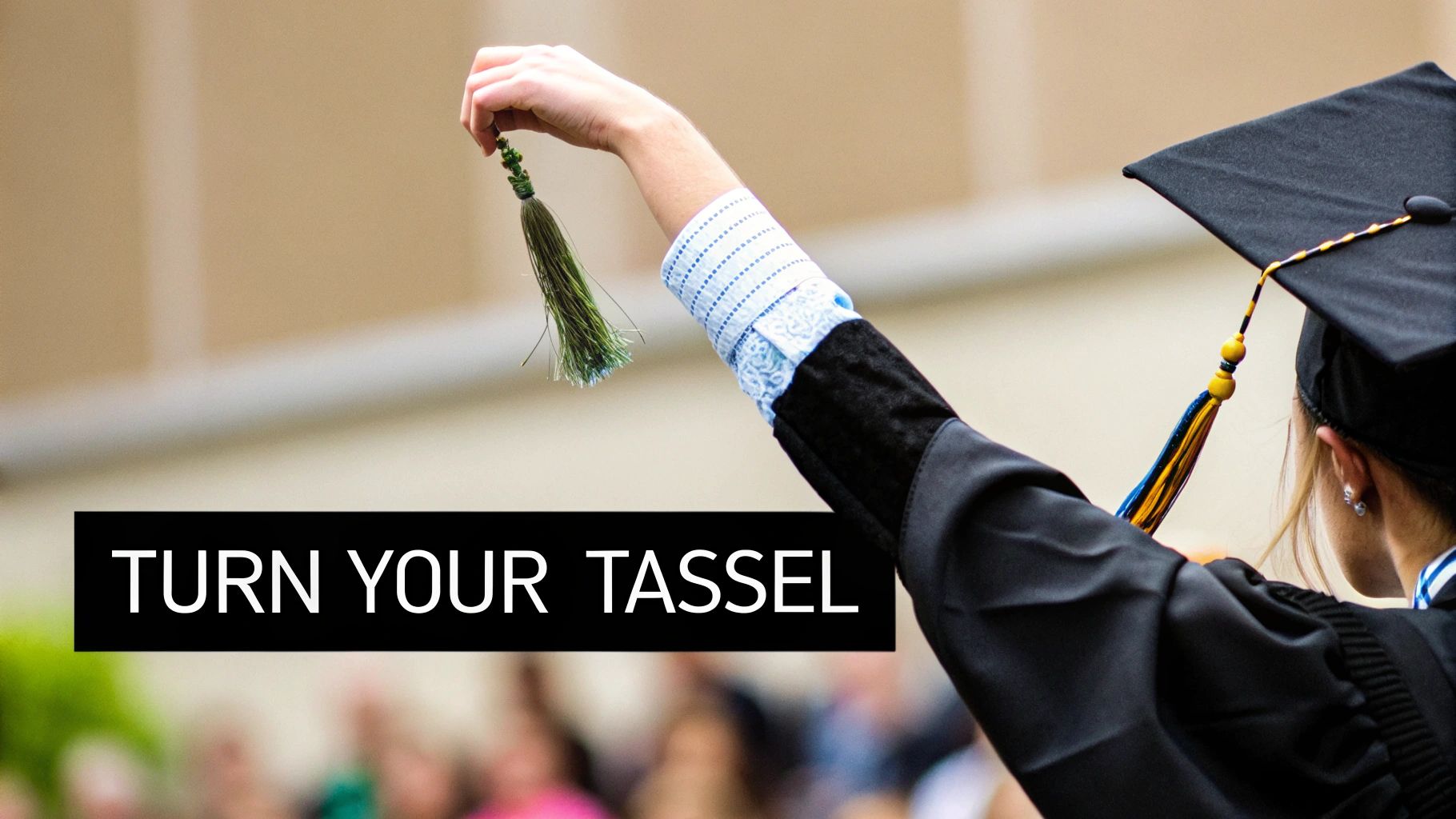 A graduate in cap and gown holds up a green tassel against a blurred background with text overlay.