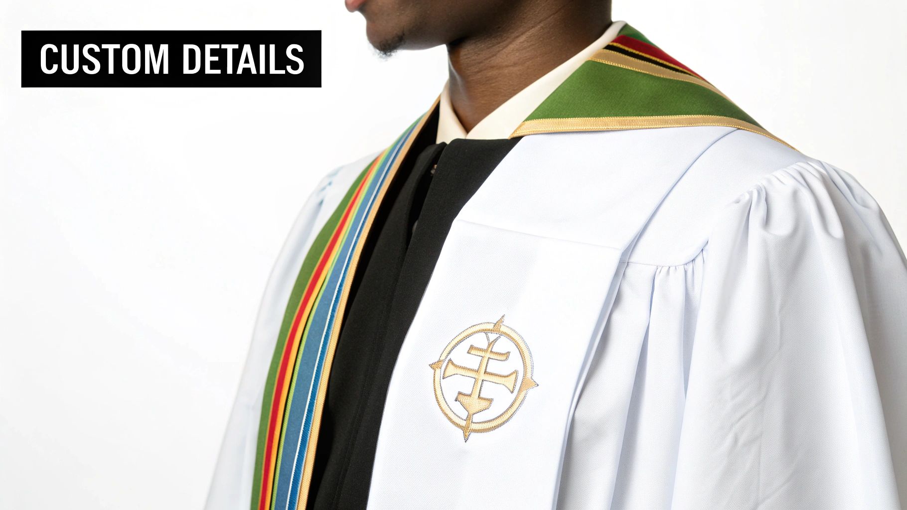 A close-up of a person wearing a white choir robe with a colorful stole and a golden embroidered emblem.