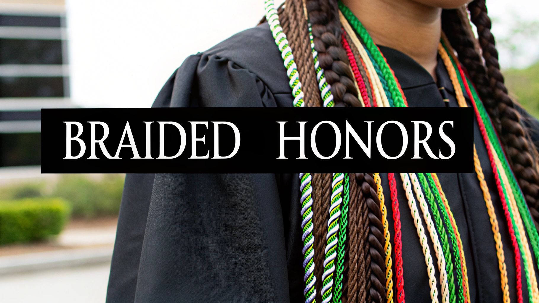 Graduates showing off their multiple, colorful honor cords and stoles.