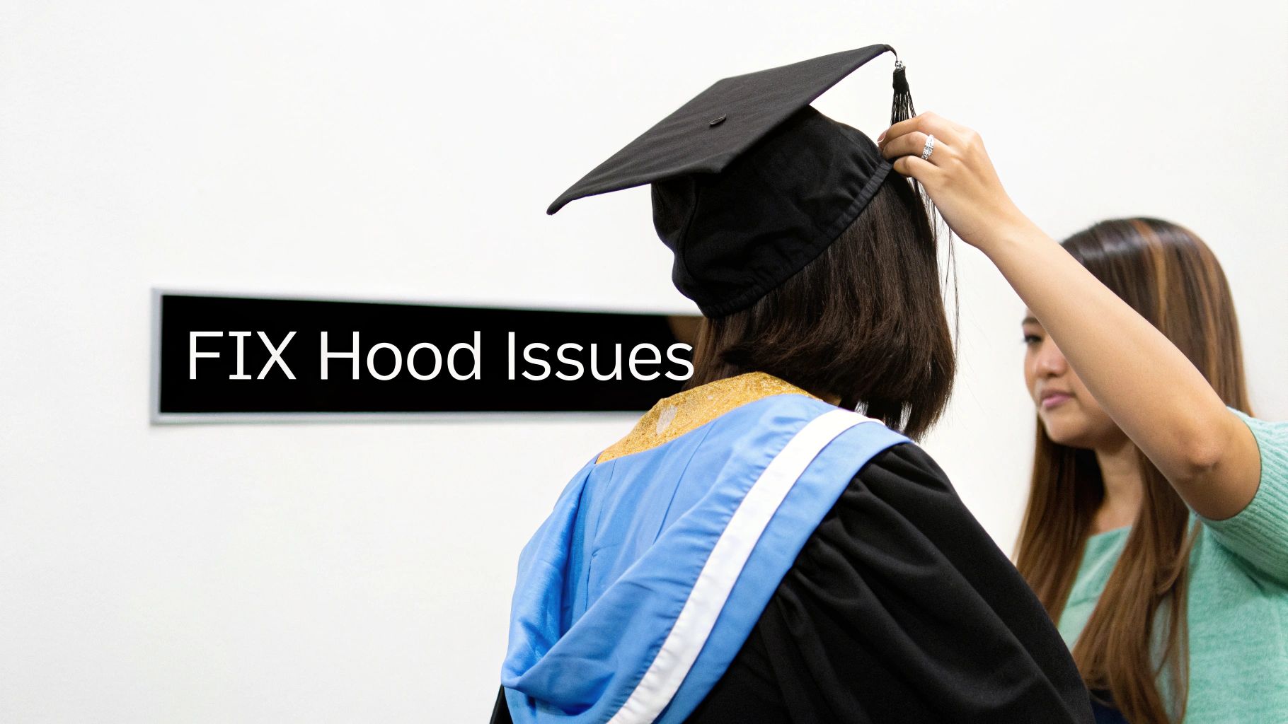A friend helps a graduate adjust her academic hood from behind.