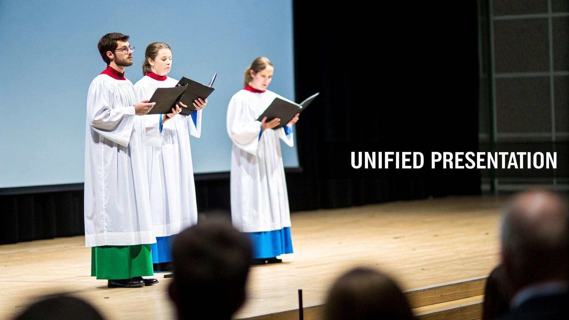 Three individuals in choir robes hold music folders, performing a unified presentation on stage.