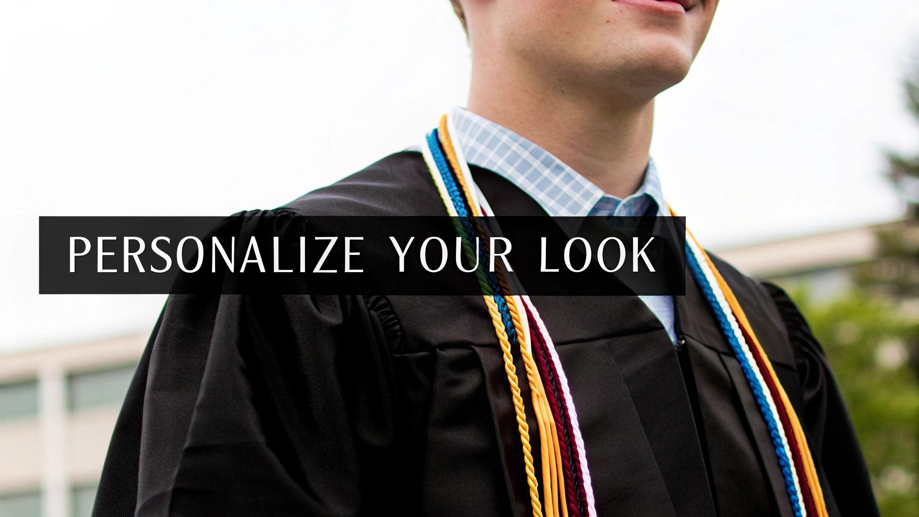 A smiling graduate wears a black gown and colorful honor cords with text: "PERSONALIZE YOUR LOOK".