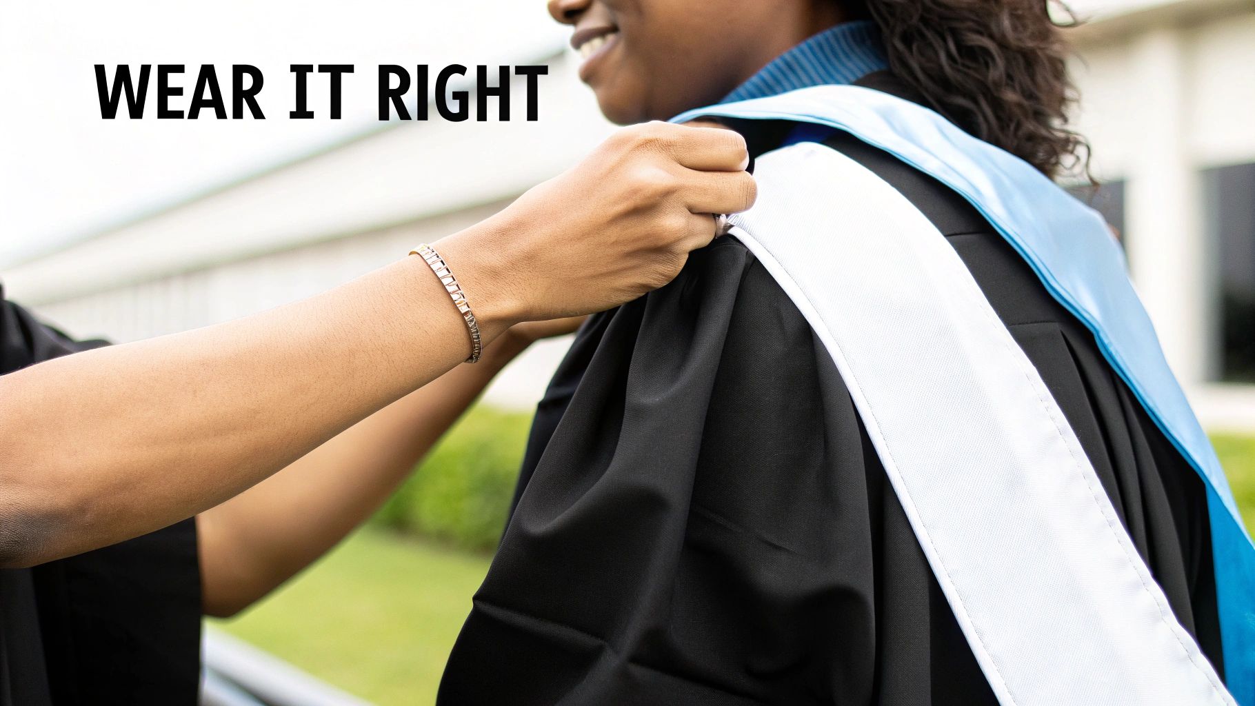 Hands adjusting a light blue and white graduation stole on a person wearing a black gown, with 'WEAR IT RIGHT' text.