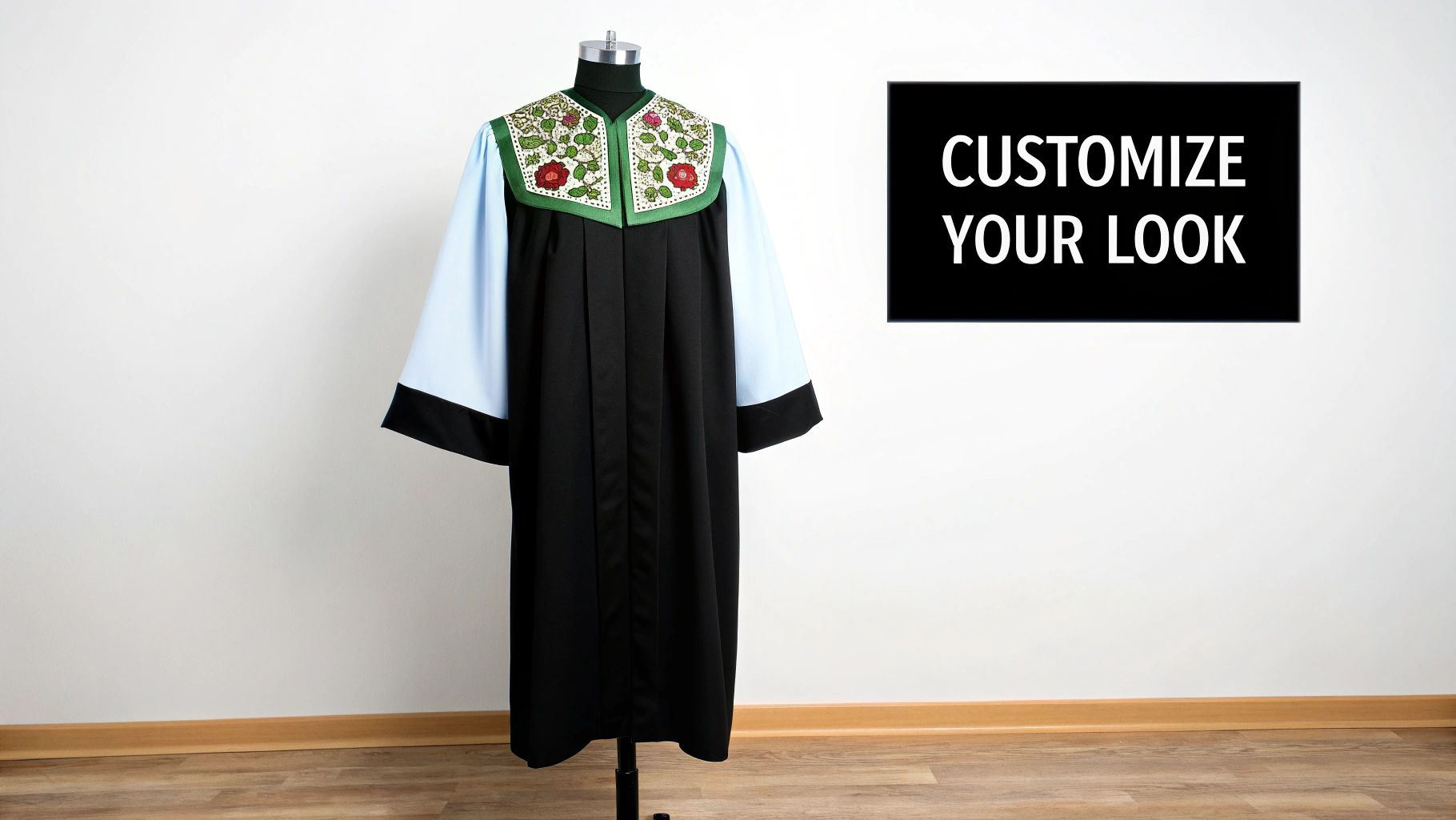 Black gospel choir robe with embroidered floral collar and light blue sleeves on a mannequin.