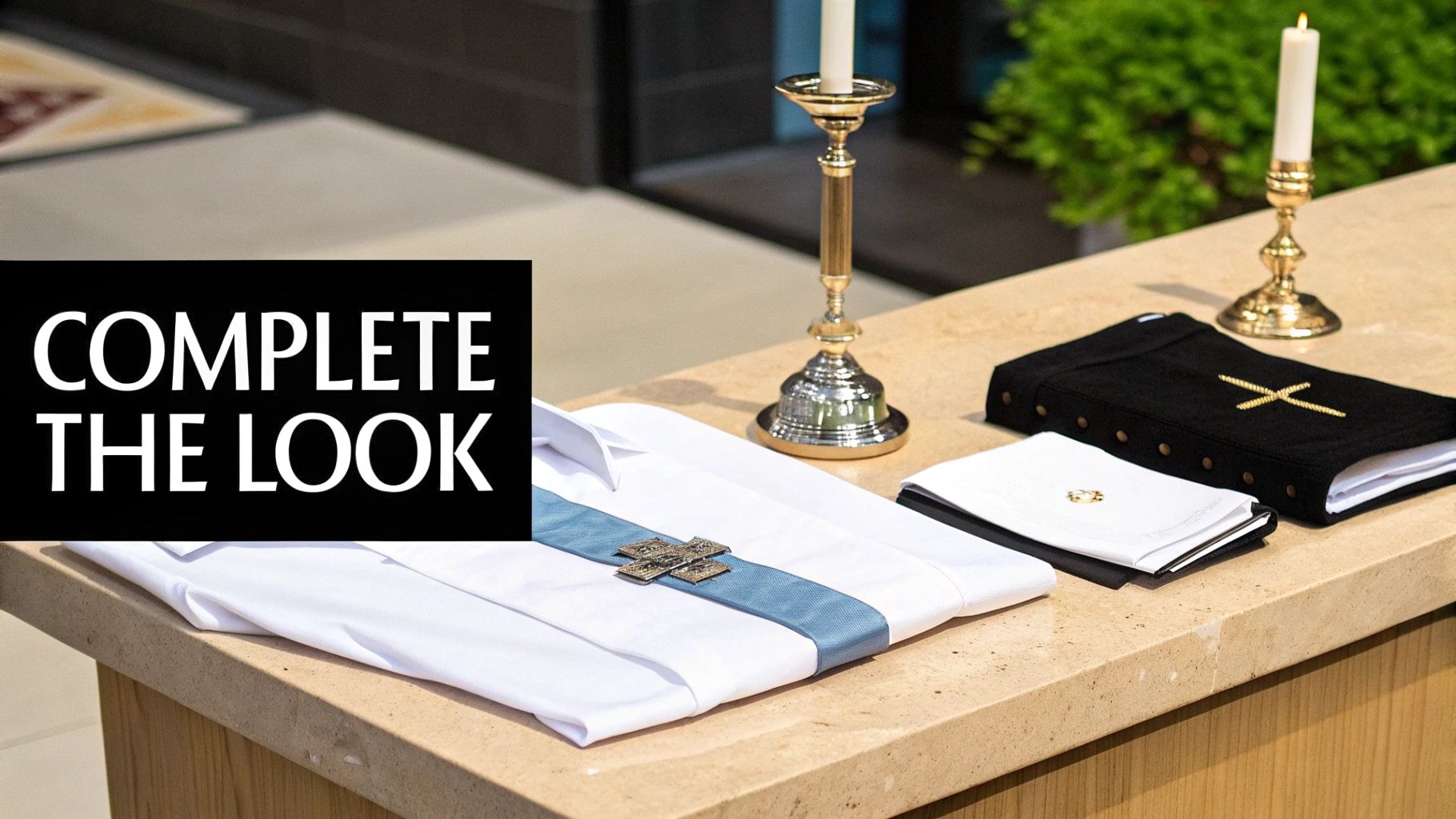 Clerical vestments, including a white shirt and blue stole, with religious books and lit candles on a church altar.