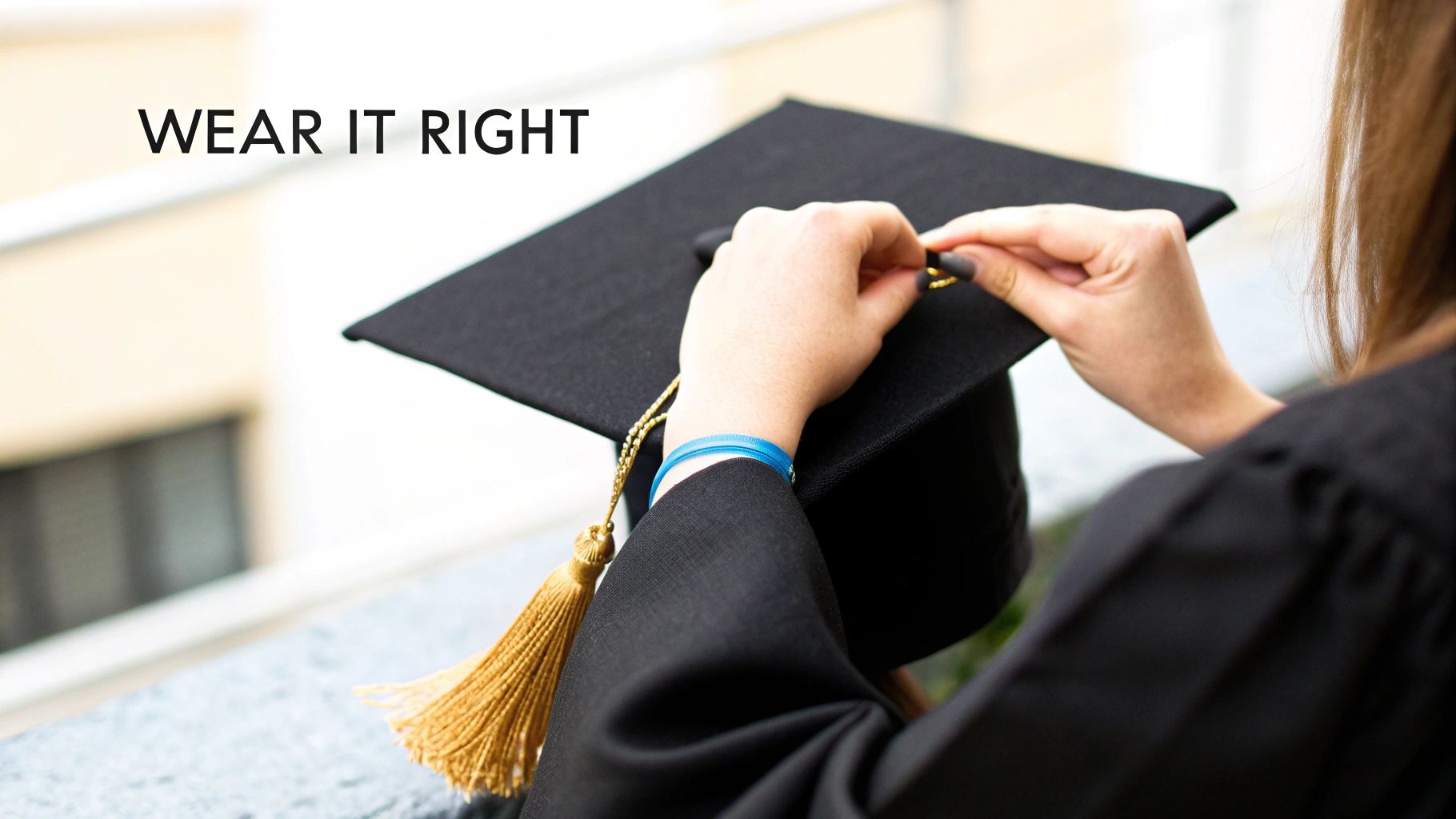 Hands adjust a golden tassel on a black graduation cap, emphasizing proper wear.