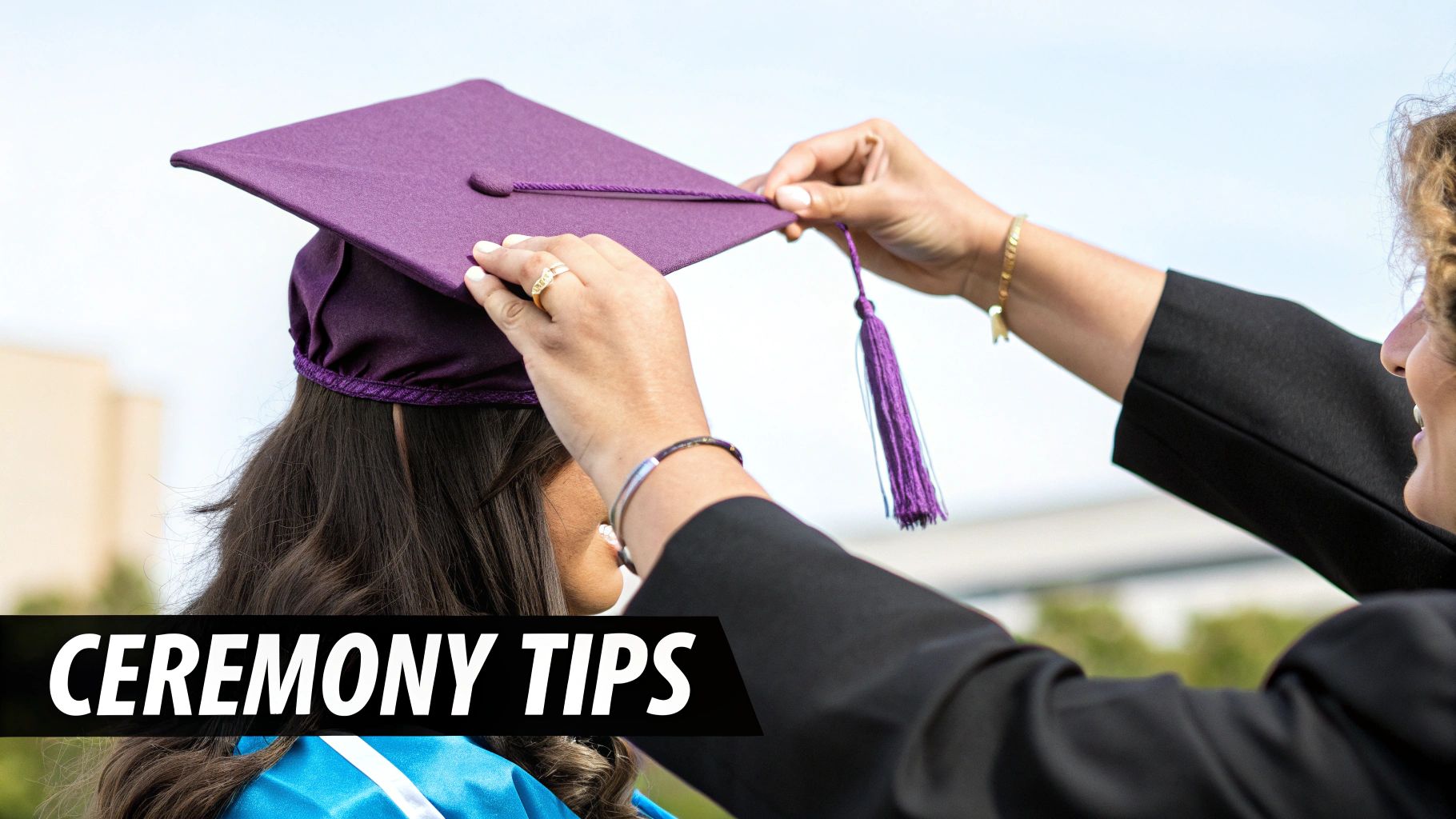 Graduate adjusting her purple graduation cap