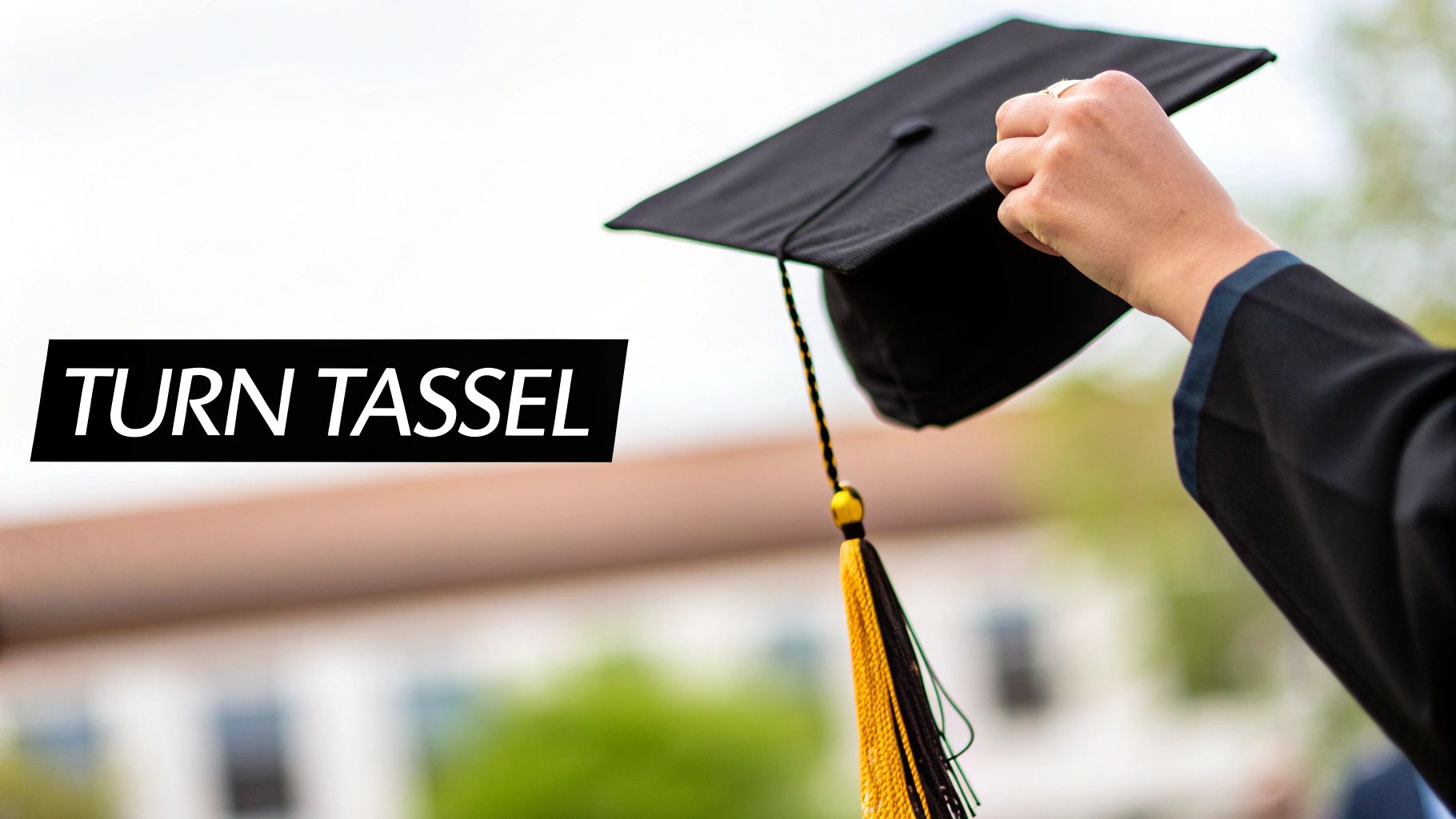 A graduate holds their cap with the tassel clearly visible