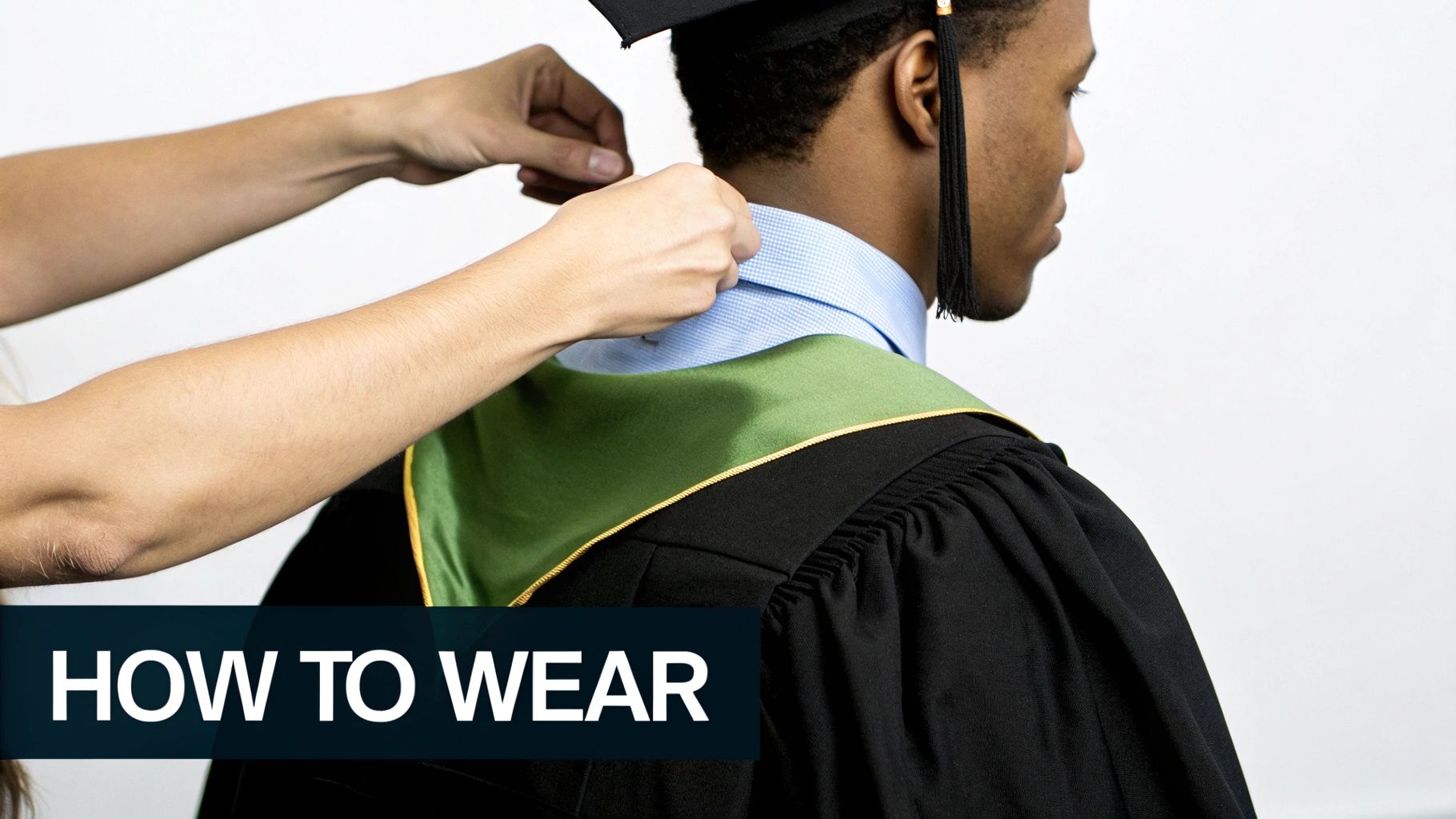 Hands adjust a green graduation hood on a person wearing a black gown and blue shirt, with text 'HOW TO WEAR'.
