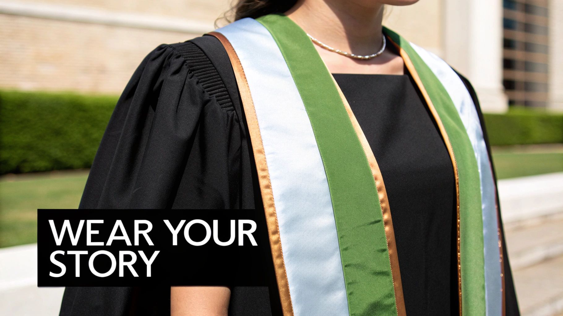 Students wearing colorful graduation stoles and smiling
