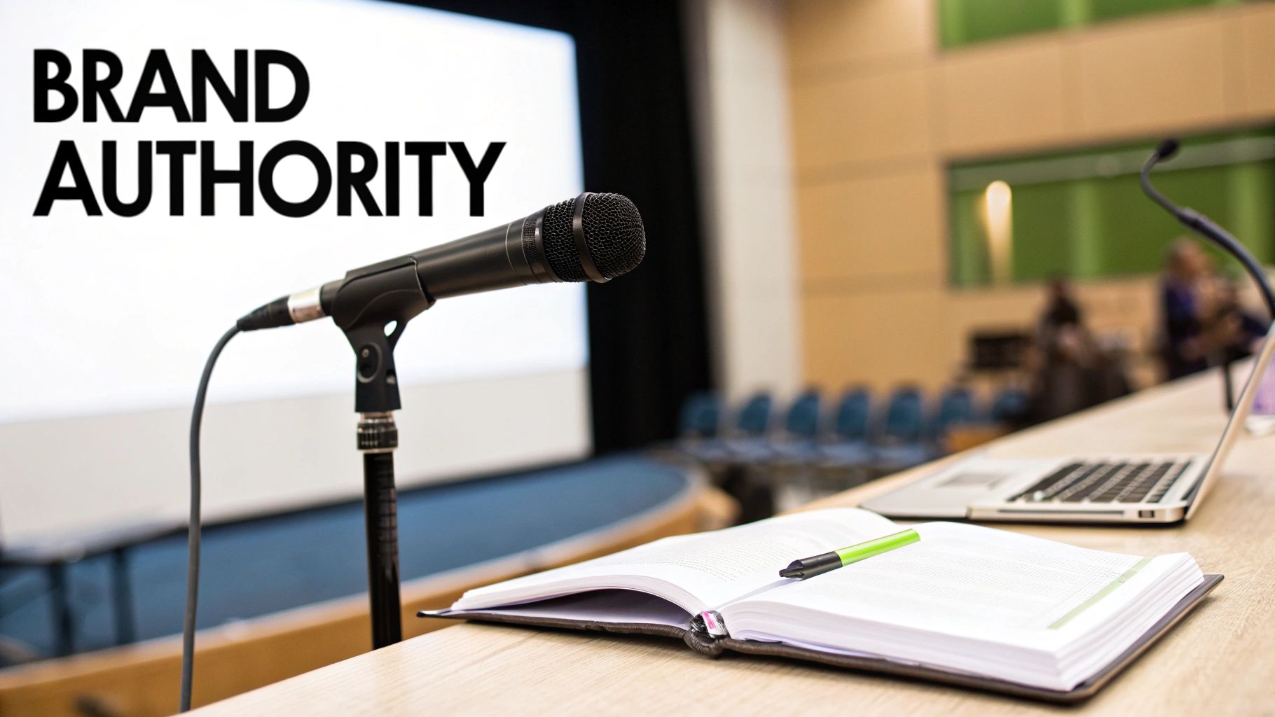A microphone on a podium in a conference room with 'BRAND AUTHORITY' displayed on a large screen.