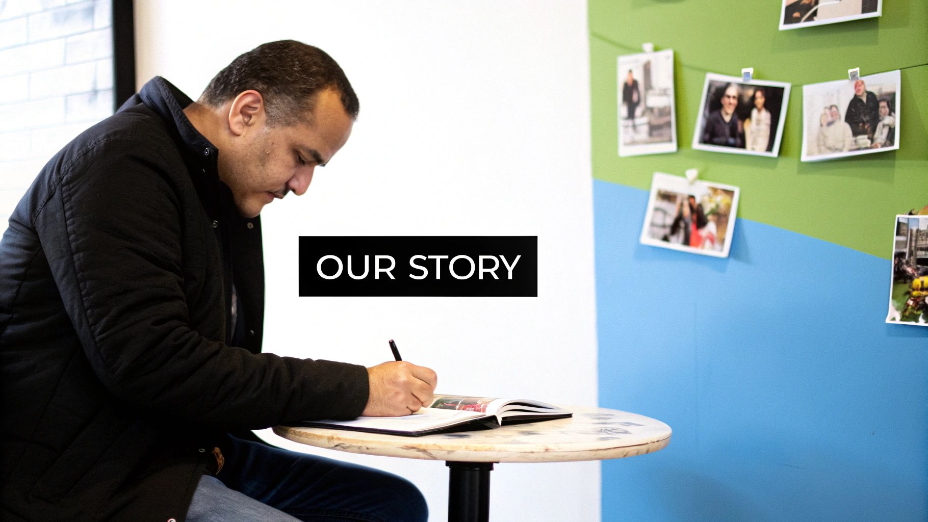 A man in a black jacket writes in a notebook at a table, with 'OUR STORY' text overlay.