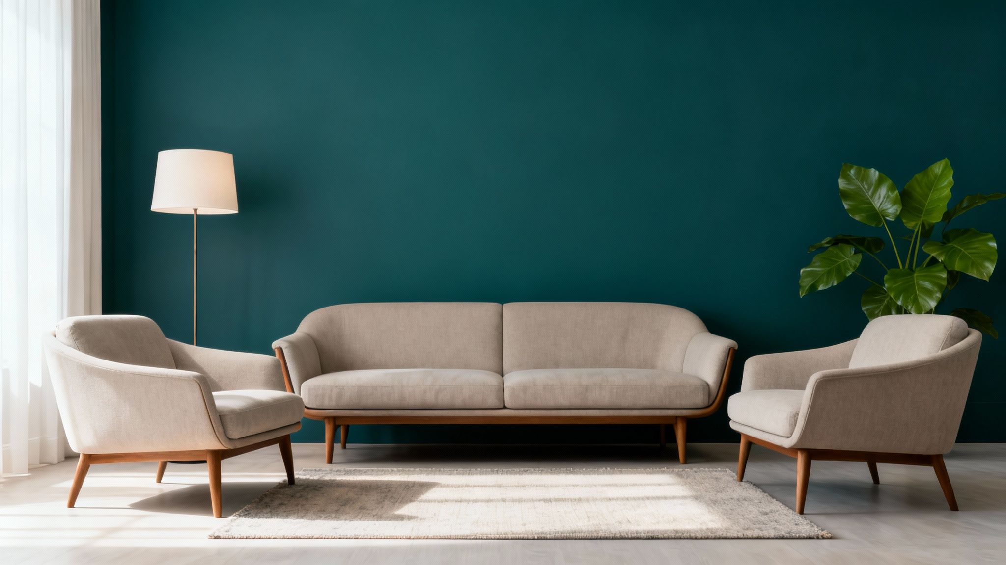 A minimalist living room with a teal wall, beige sofa, two armchairs, a floor lamp, and a plant.