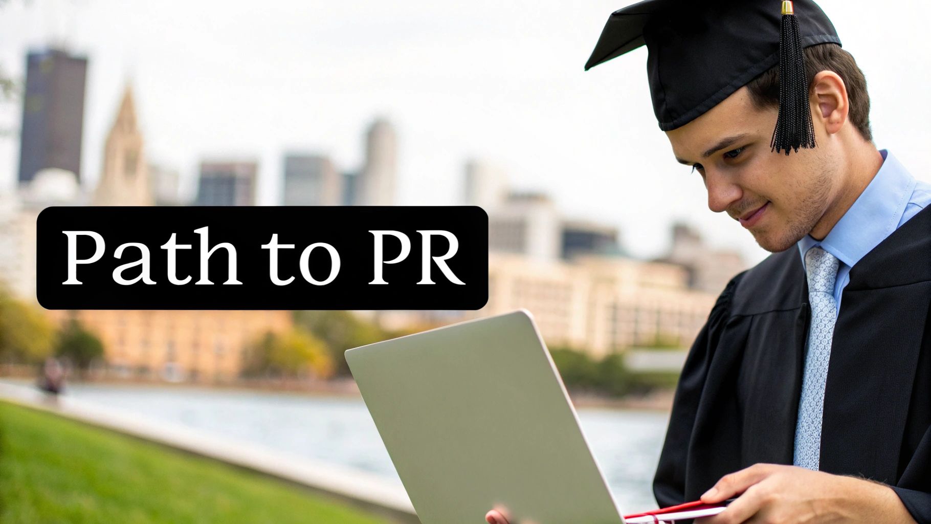 A male graduate in cap and gown smiles, looking at a laptop with 'Path to PR' text and city in background.