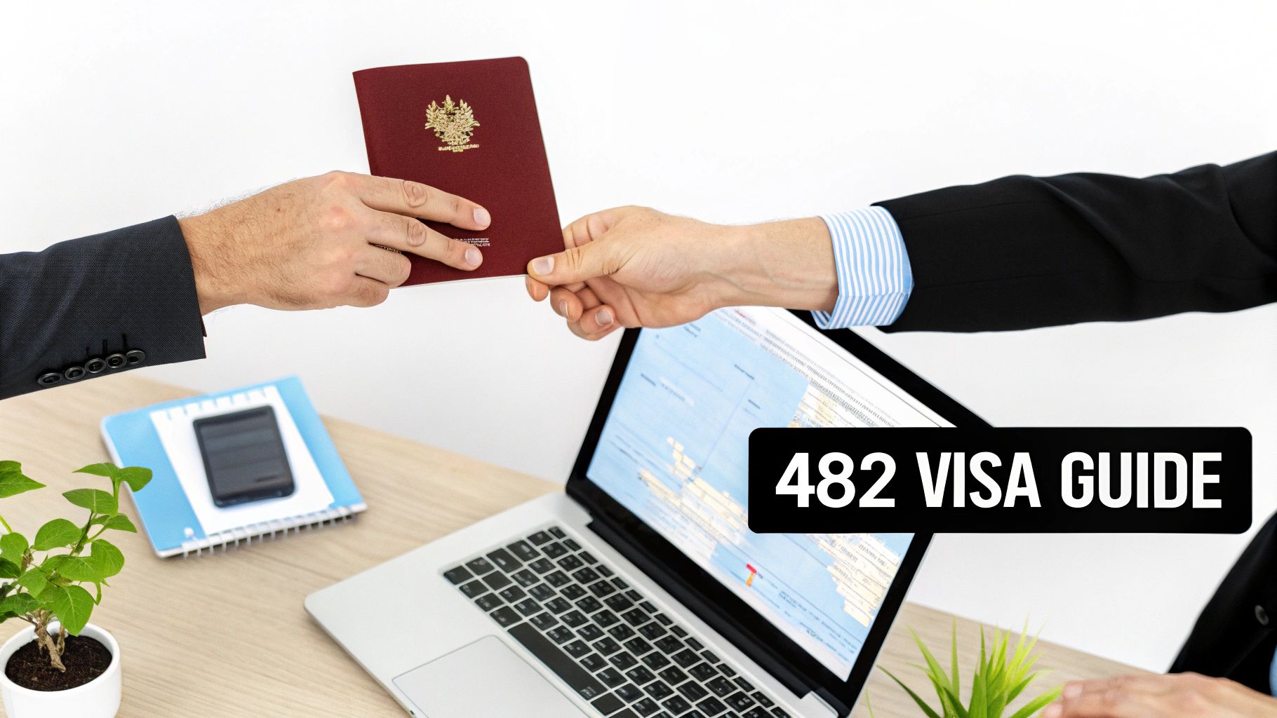 Two hands exchanging a maroon passport over a desk with a laptop displaying '482 VISA GUIDE'.