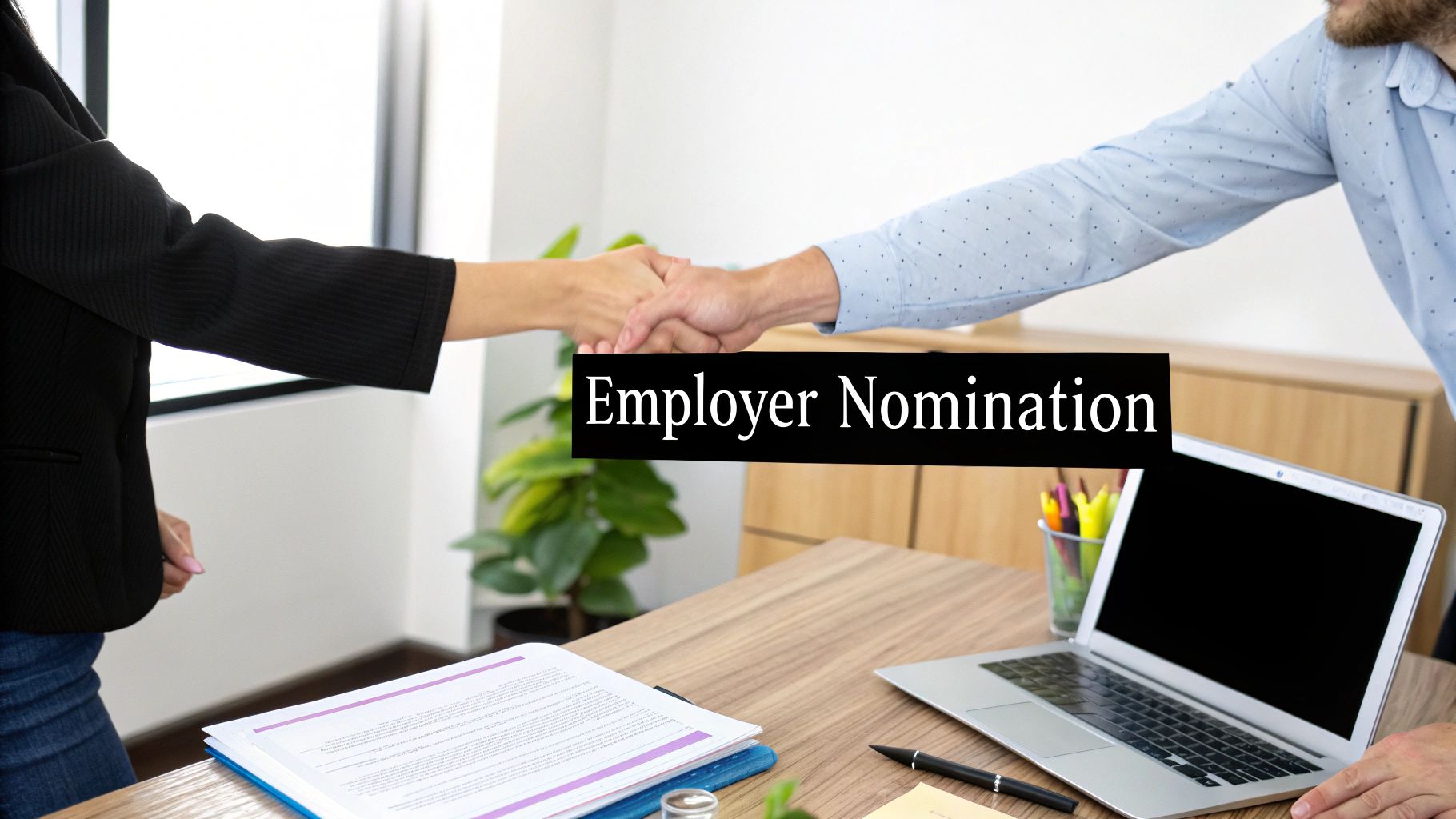 Two professionals shaking hands over a desk with documents and a laptop, displaying 'Employer Nomination'.