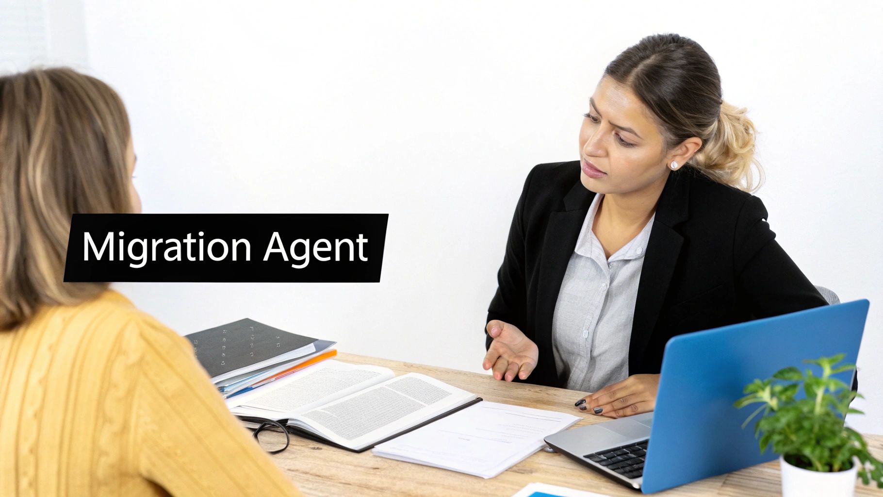A migration agent advises a client at a desk with documents and a laptop, discussing visa requirements.
