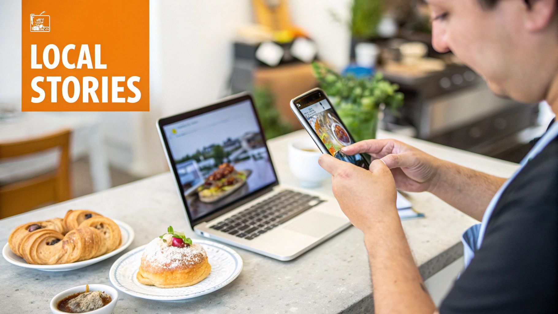Person using a smartphone and laptop to view food images, with pastries on a table and 'LOCAL STORIES' branding.