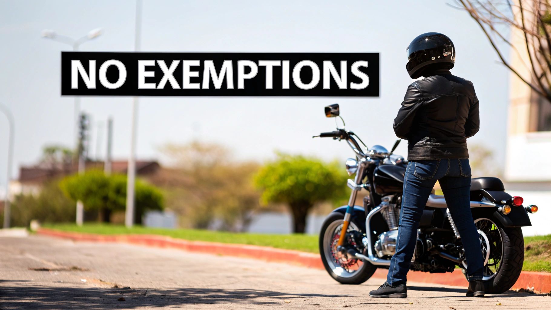 A motorcycle rider on a scenic California road, fully compliant with helmet laws.