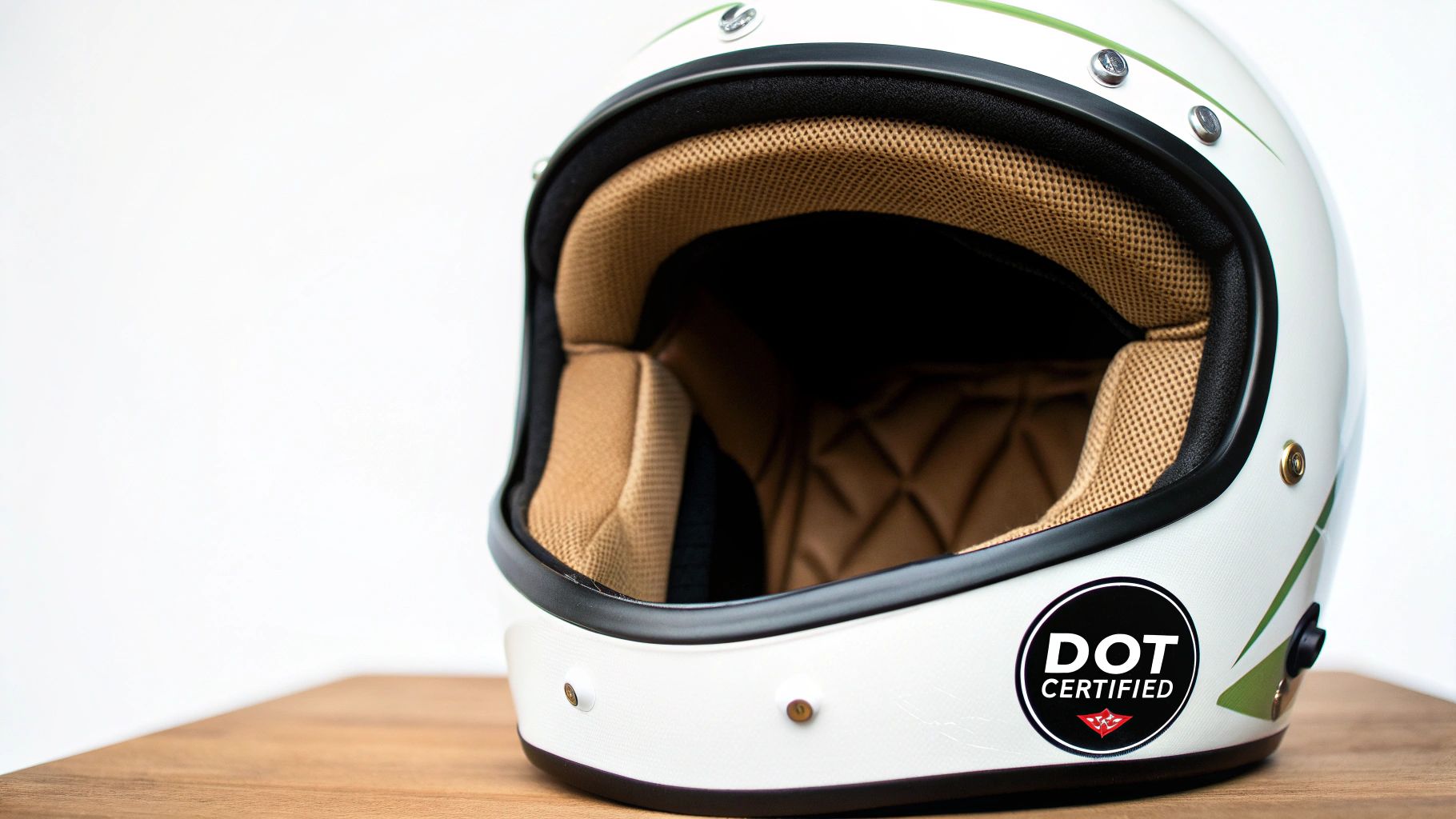 A close-up of a DOT-approved motorcycle helmet showing the sticker and safety features.
