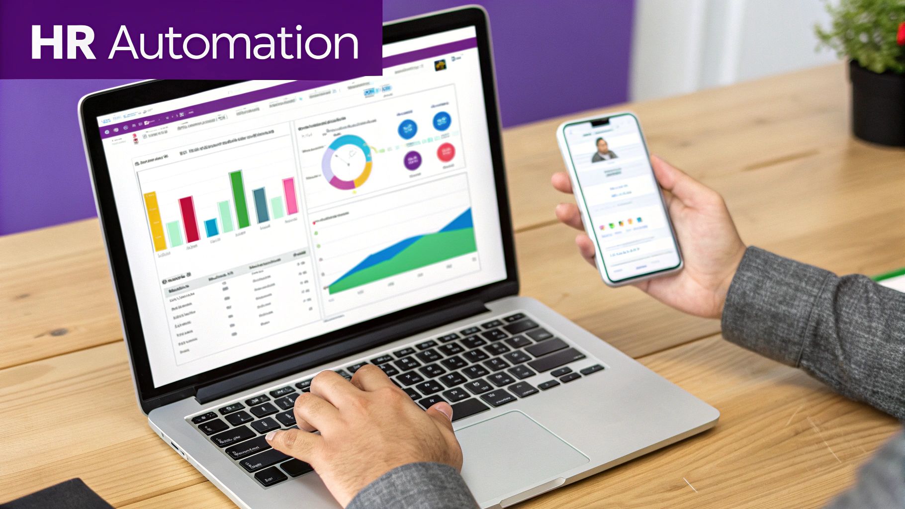 Person using a laptop displaying HR automation dashboards and holding a smartphone with an employee profile.