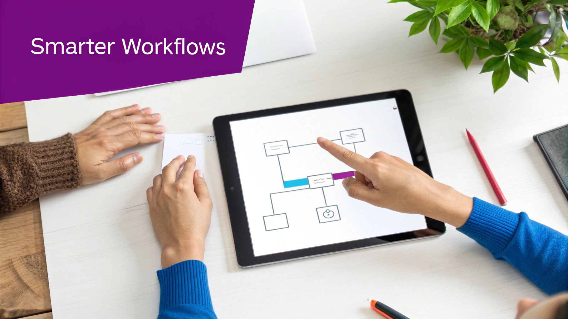 Two professionals using a tablet to analyse and improve digital workflows, enhancing productivity.