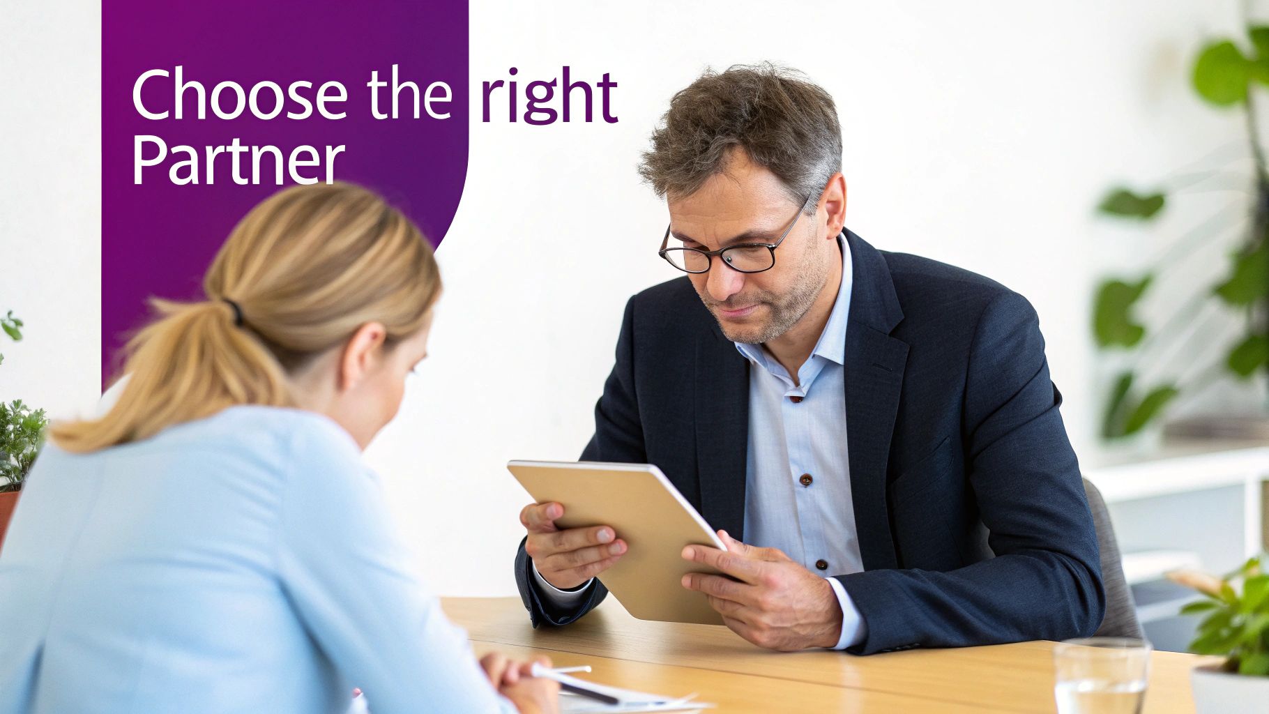 Man and woman collaborate in an office, reviewing content on a tablet. Text: 'Choose the right Partner'.