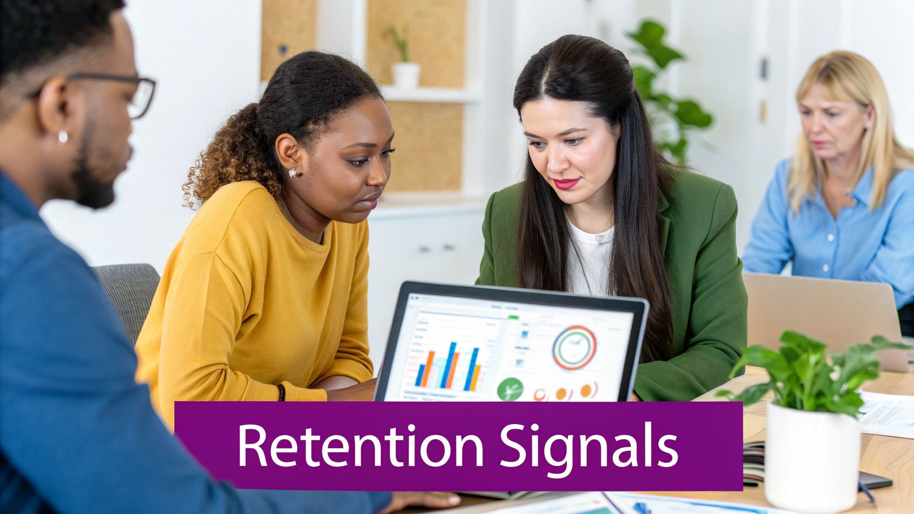 Diverse professionals analyze data on a laptop, focusing on graphs and charts in an office setting.