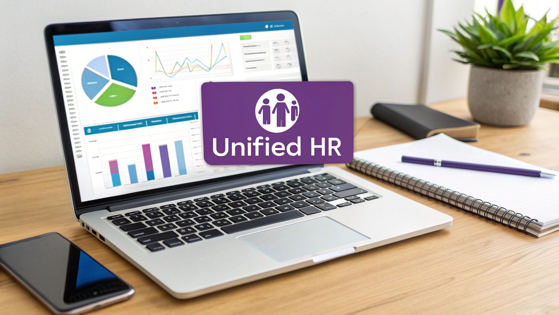 Laptop displaying HR analytics with 'Unified HR' overlay, alongside office supplies on a wooden desk.