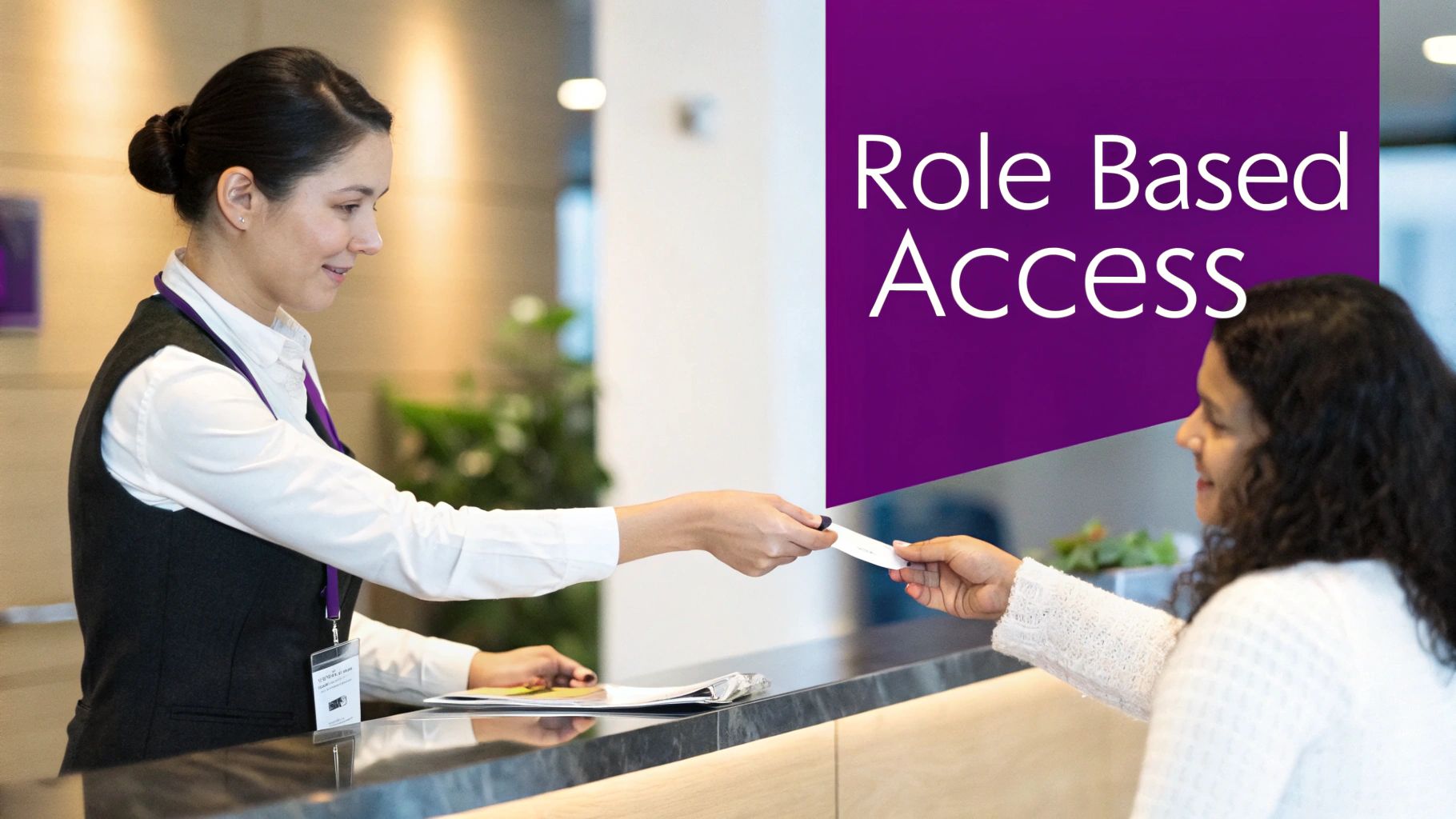 A receptionist hands an access card to a smiling guest at a counter, illustrating role-based access.