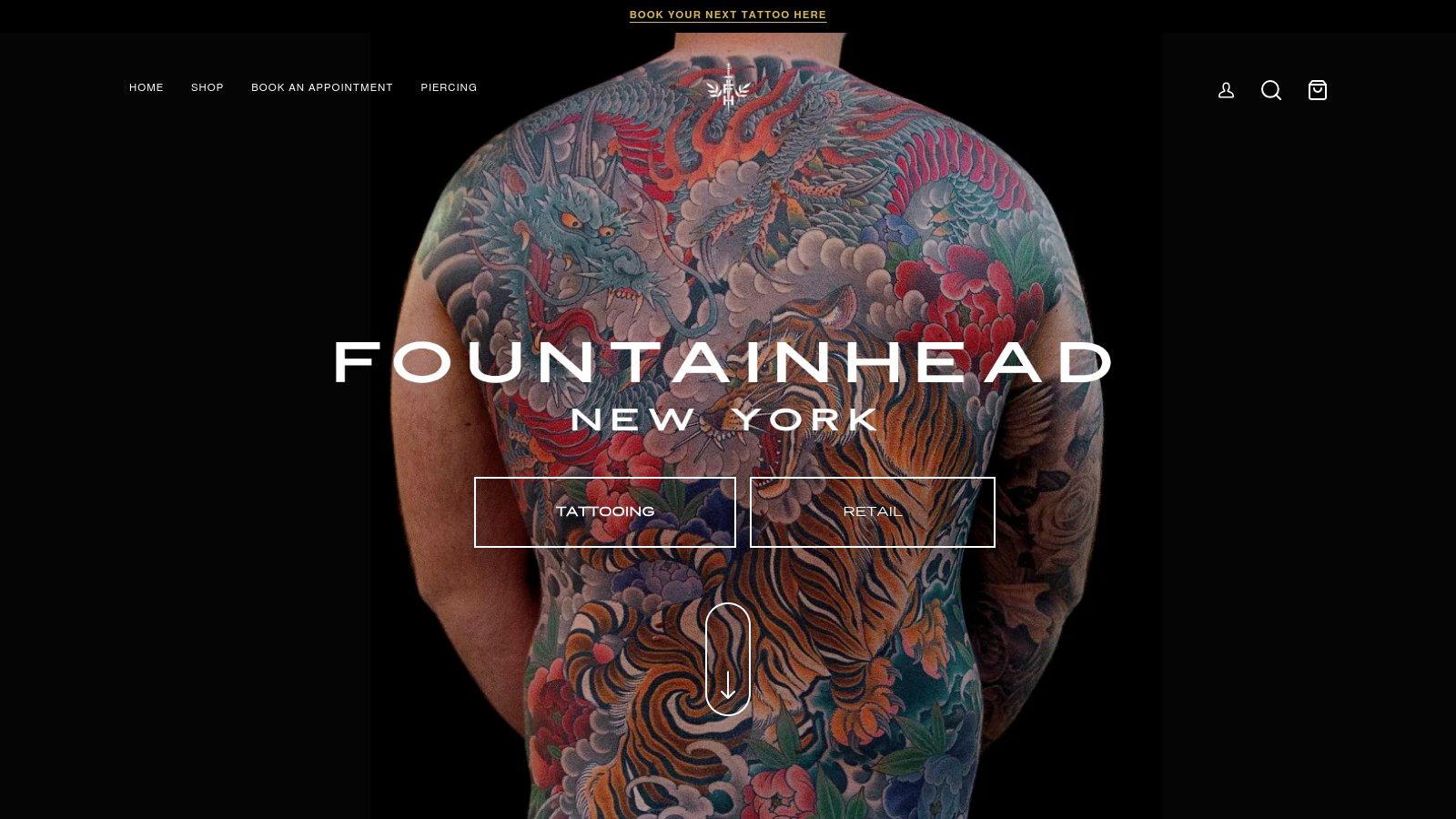A person's full back is covered in a detailed, vibrant Japanese-style tattoo featuring a dragon and waves.