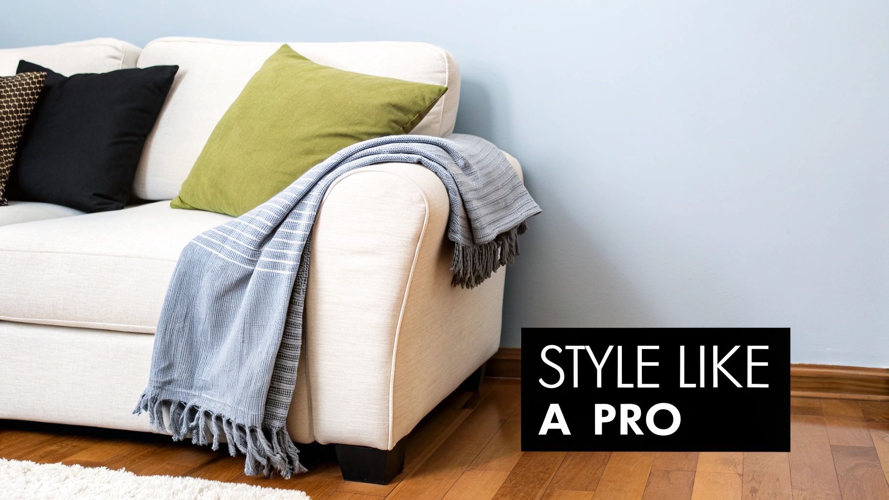 A stylishly draped throw on a modern sofa.