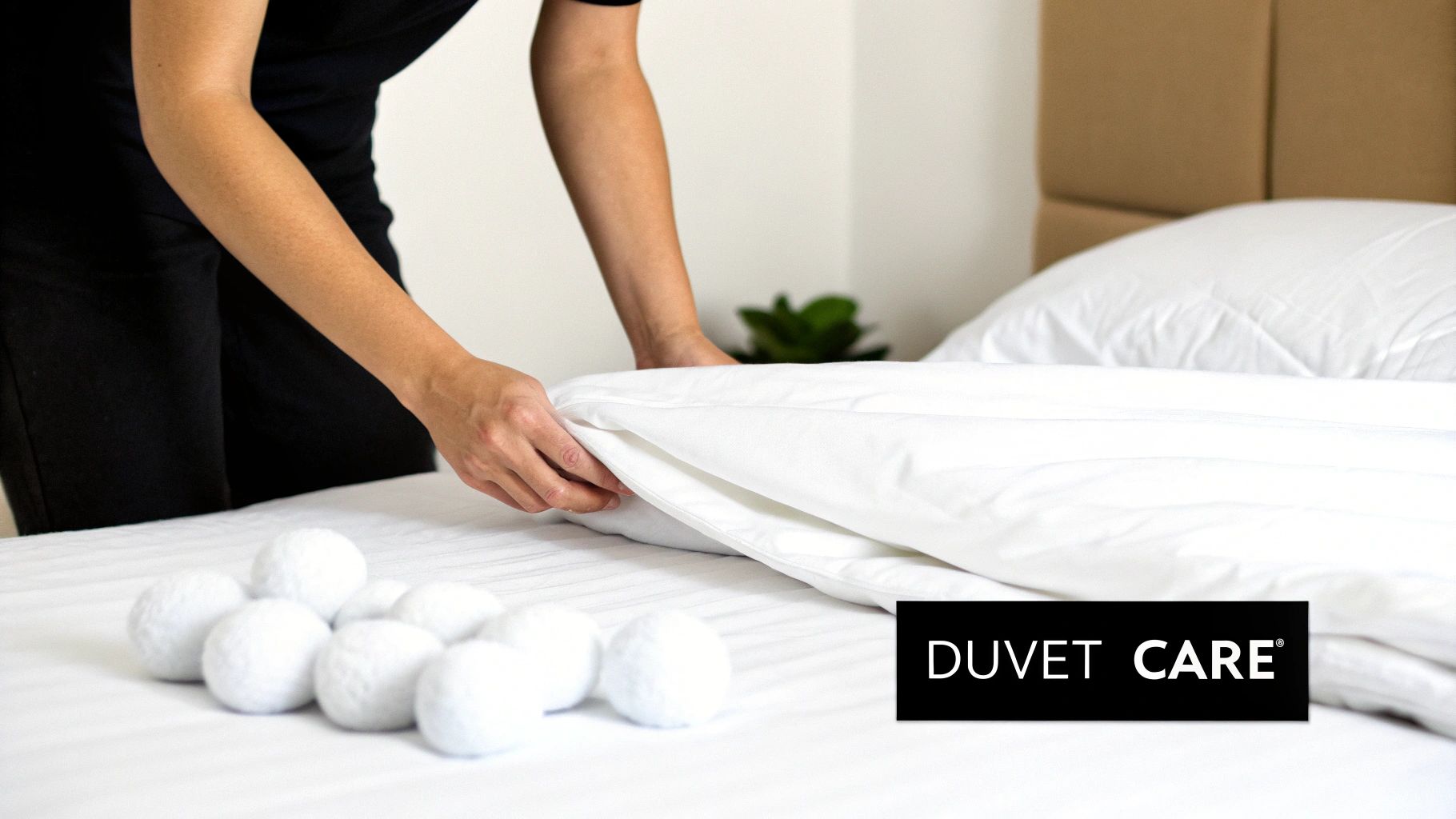 Woman holding a clean, folded king size duvet
