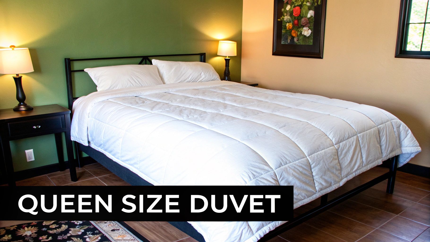 A neatly made bed with a white queen duvet, styled with decorative pillows and a throw blanket, in a bright, modern bedroom.