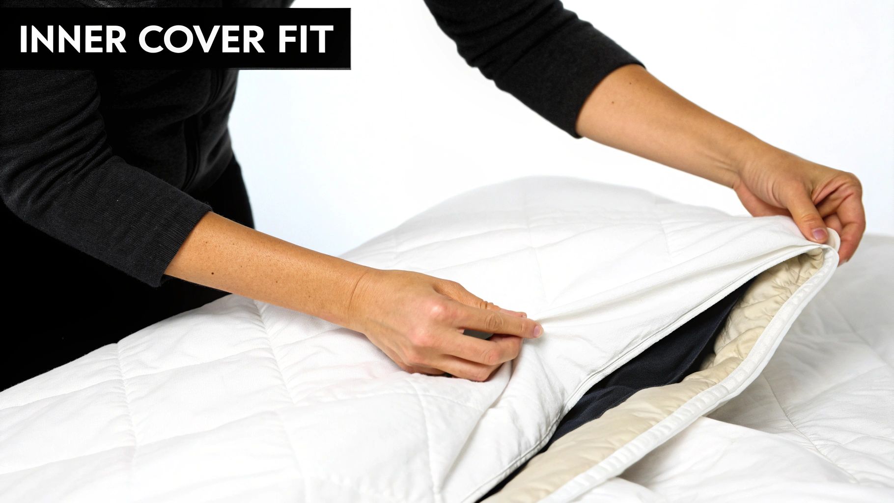 A person placing a clean, fluffy duvet into a washing machine