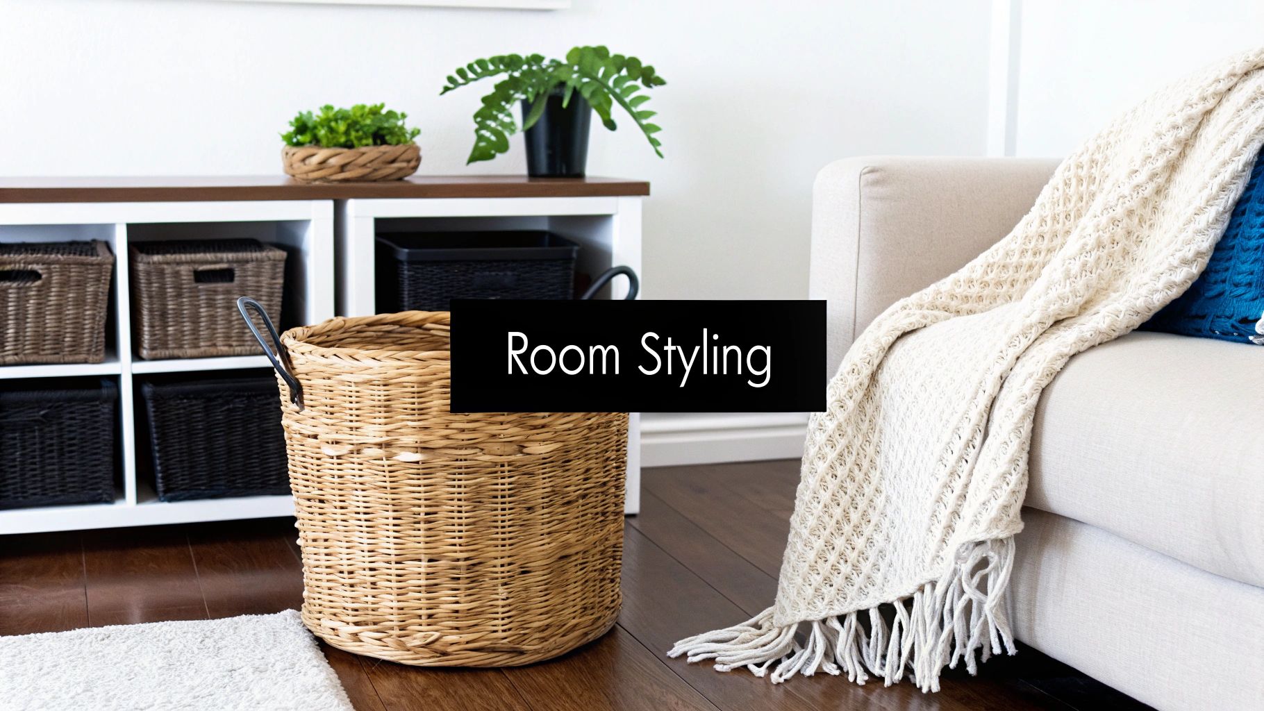 A stylish living room scene with woven storage baskets, a sofa, throw blanket, and potted plants.