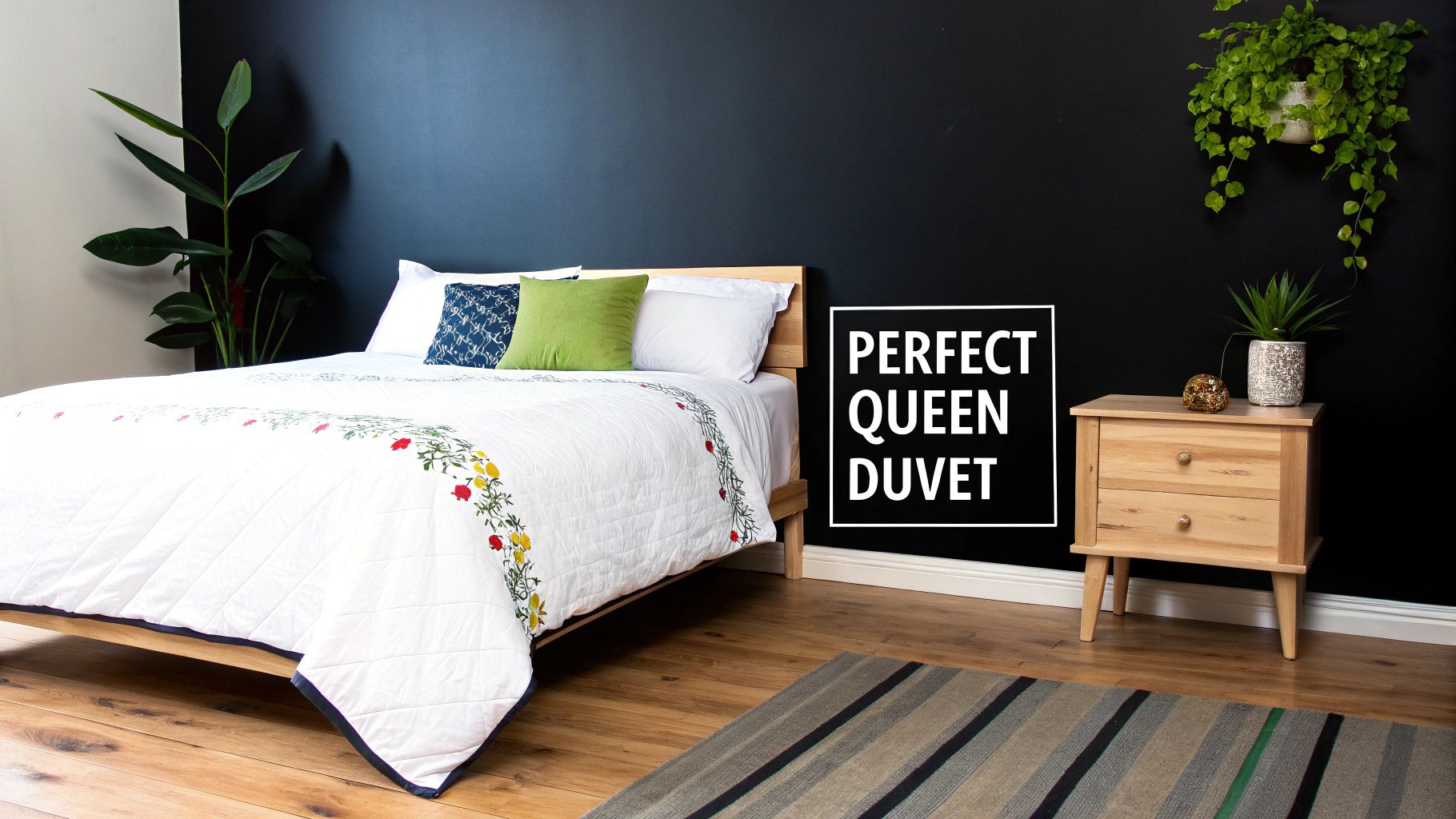 A beautifully styled bed with a textured grey queen duvet cover, layered pillows, and a cosy throw blanket in a light-filled bedroom.