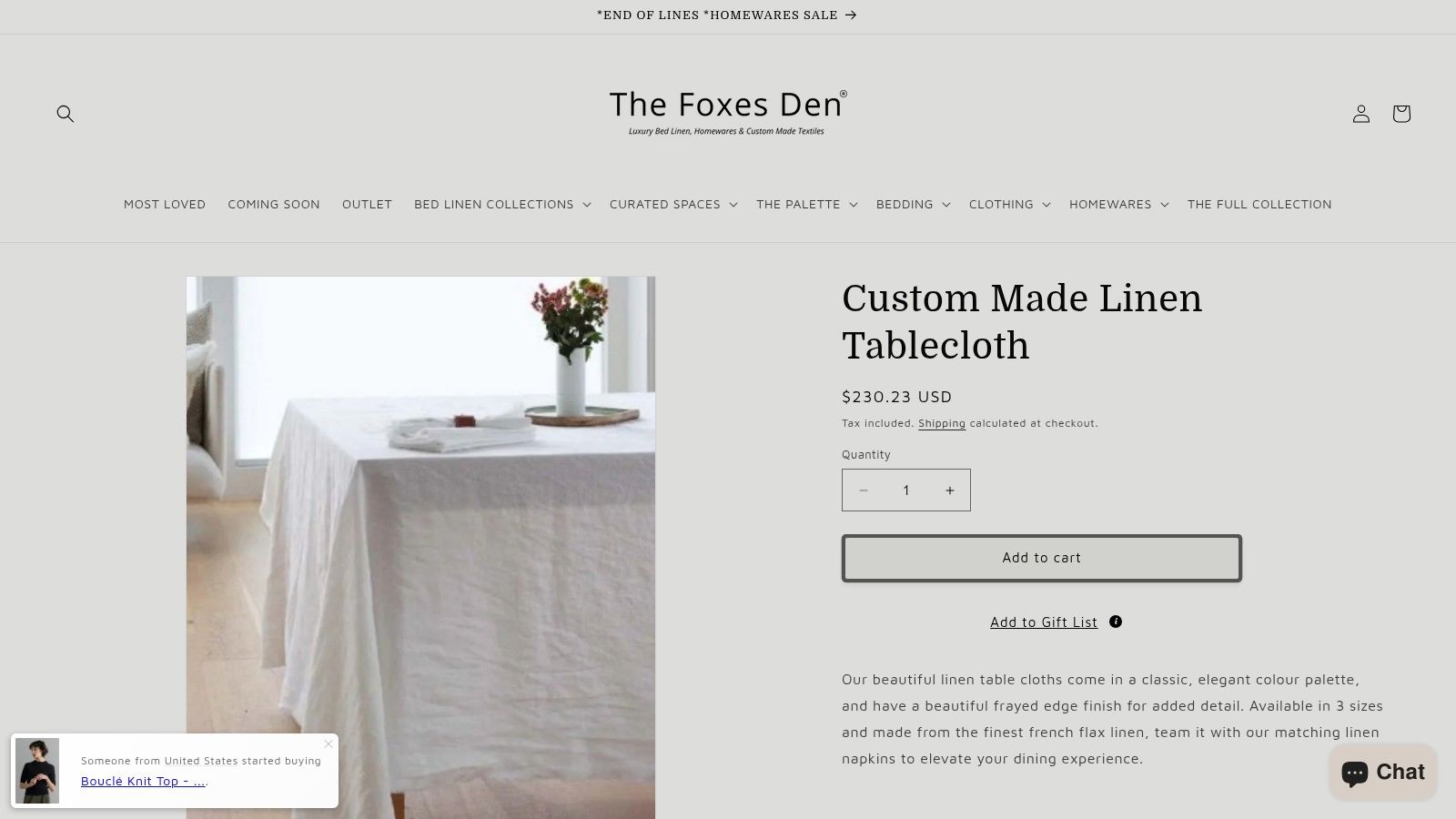 A display of folded linen textiles in various neutral shades, showcasing their texture and quality.