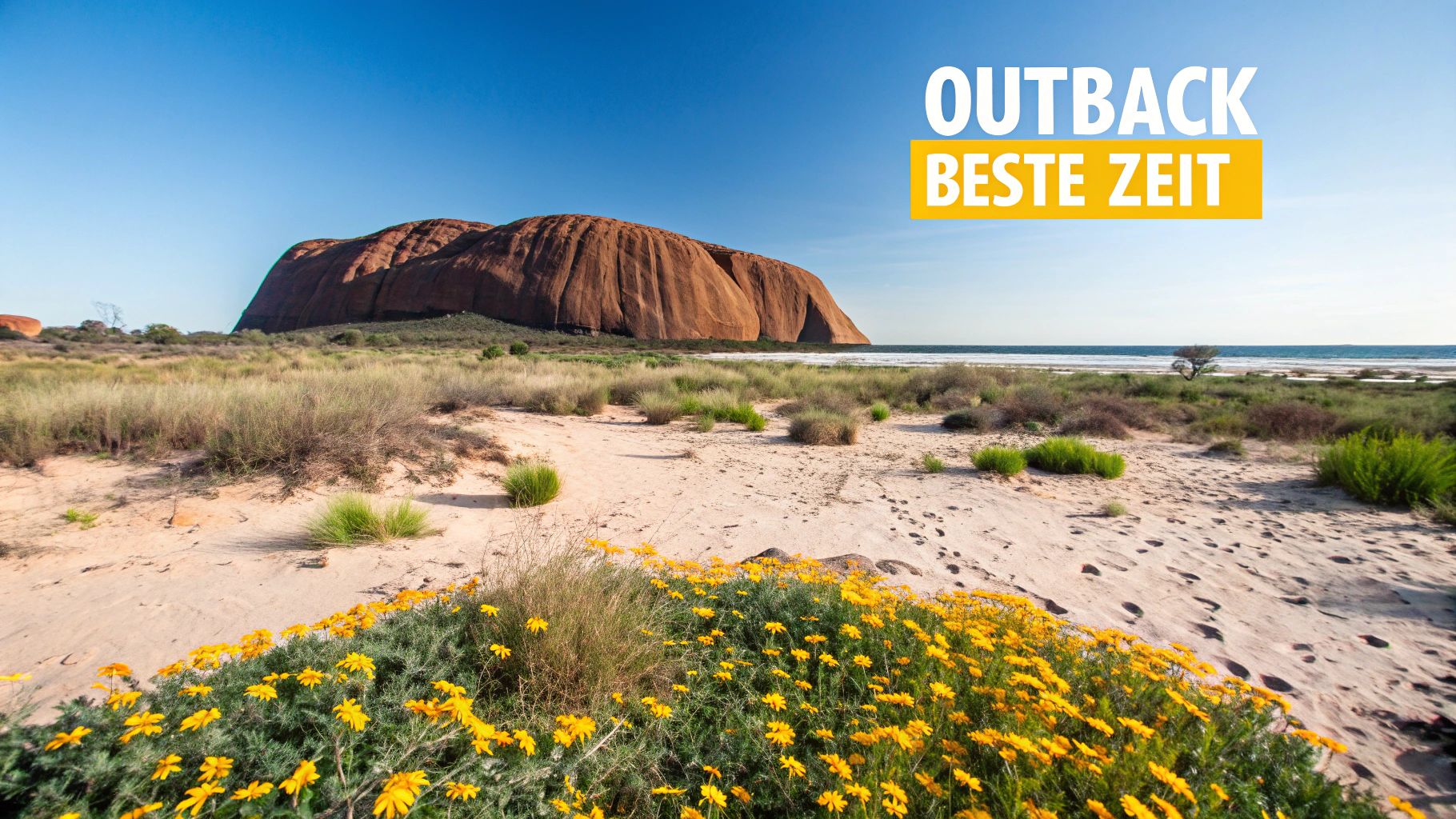Rote Felsformationen im australischen Outback unter einem klaren blauen Himmel.