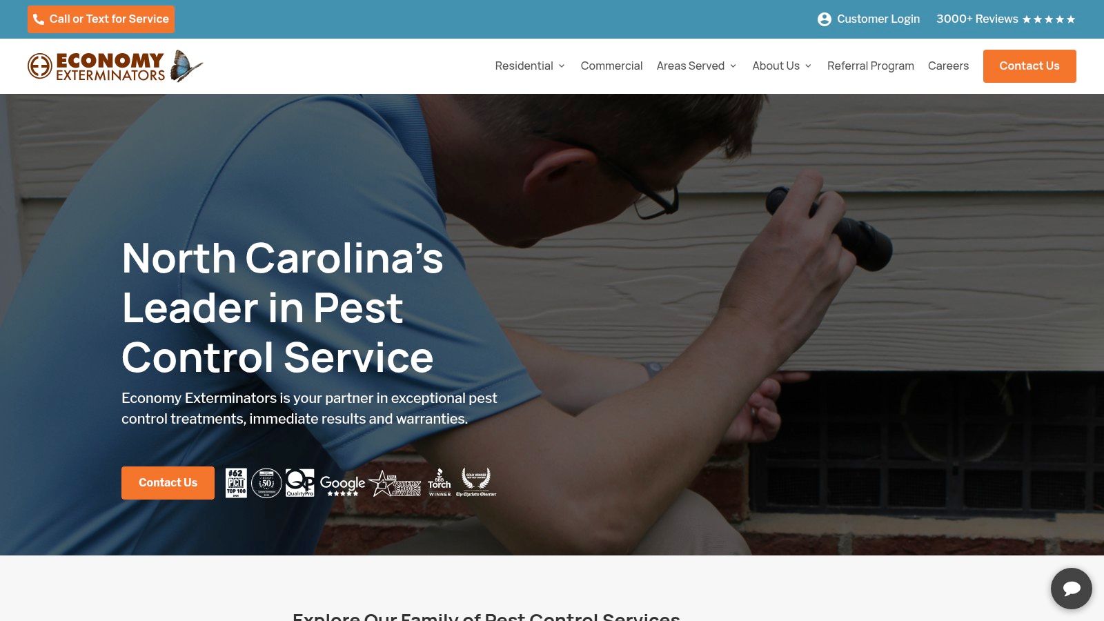 Economy Exterminators technician inspecting a Raleigh home's crawlspace
