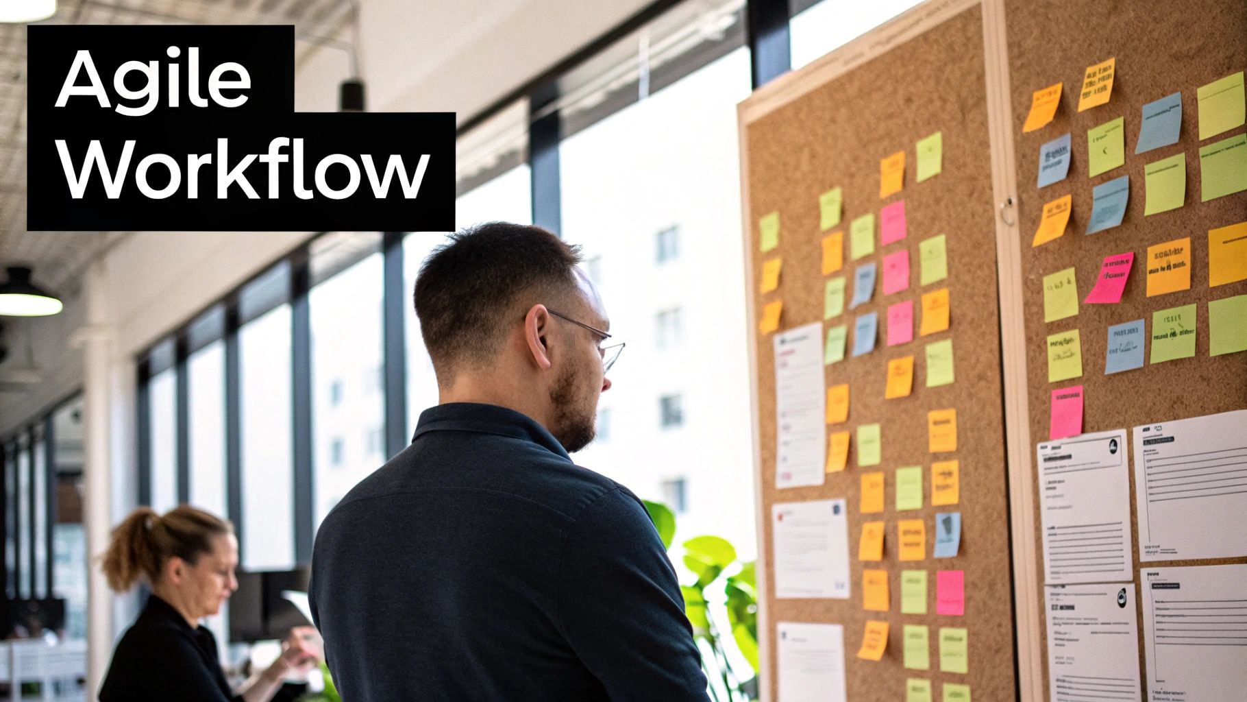 A team collaborating around a kanban board, symbolizing project success.