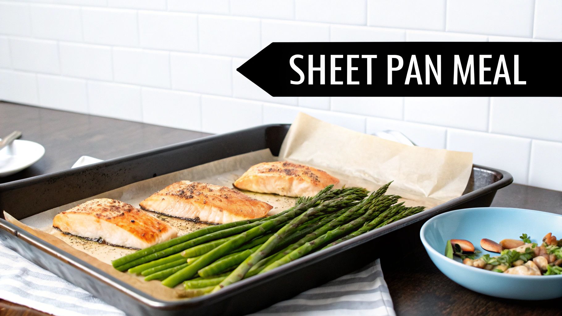 A delicious sheet pan meal featuring roasted salmon fillets and fresh green asparagus, ready for dinner.