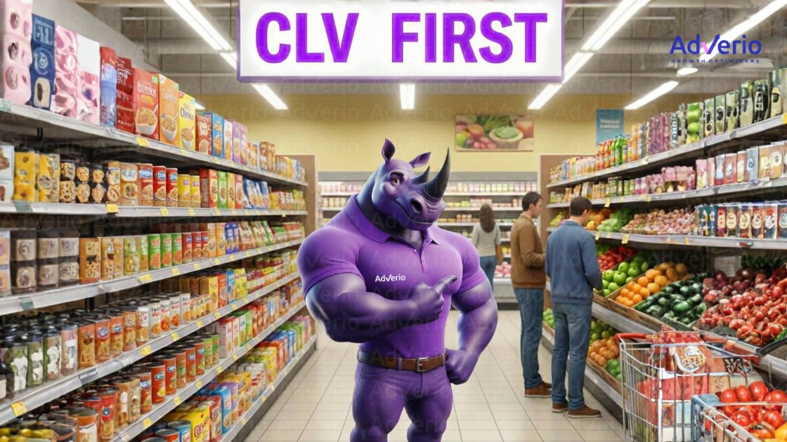 Purple rhino mascot pointing in a grocery store aisle with a 'CLV FIRST' sign above.