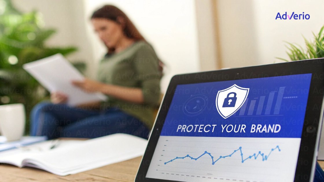A Guide to Amazon Review Removal TOS for Brand Protection 18 A tablet displays 'PROTECT YOUR BRAND' with a shield icon and a graph, while a person reads in the background.