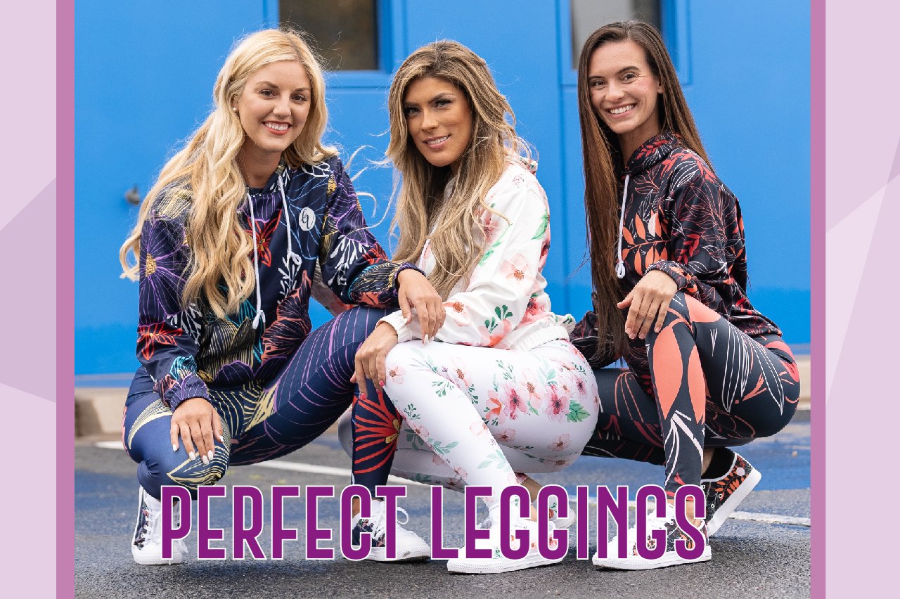 Three smiling women in patterned hoodies and leggings are crouching against a blue background.